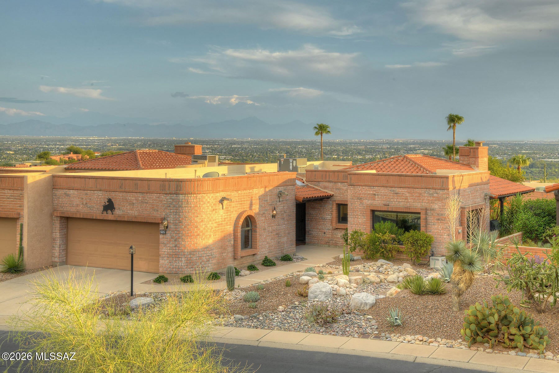 Seller will accept or counter offers between $650,000 and $675,000. VA assumable loan at 6.25%. DON'T MISS OUT on this 2BD, 2BA townhome in the Foothills! Experience luxury living w/fabulous kitchen remodeled and featuring high end stainless appliances, white shaker style cabinets, quartz countertops, custom tiled backsplash, and designed to be bright and open with lots of natural light! Kitchen opens to expansive great room featuring high ceilings and a gas fireplace! Next to the kitchen is a room that could be a large formal dining room or separate den! The professionally landscaped backyard is low maintenance w/beautiful pavers, artificial grass & drought tolerant plants that thrive in Tucson climate! The patio offers amazing views day & night!