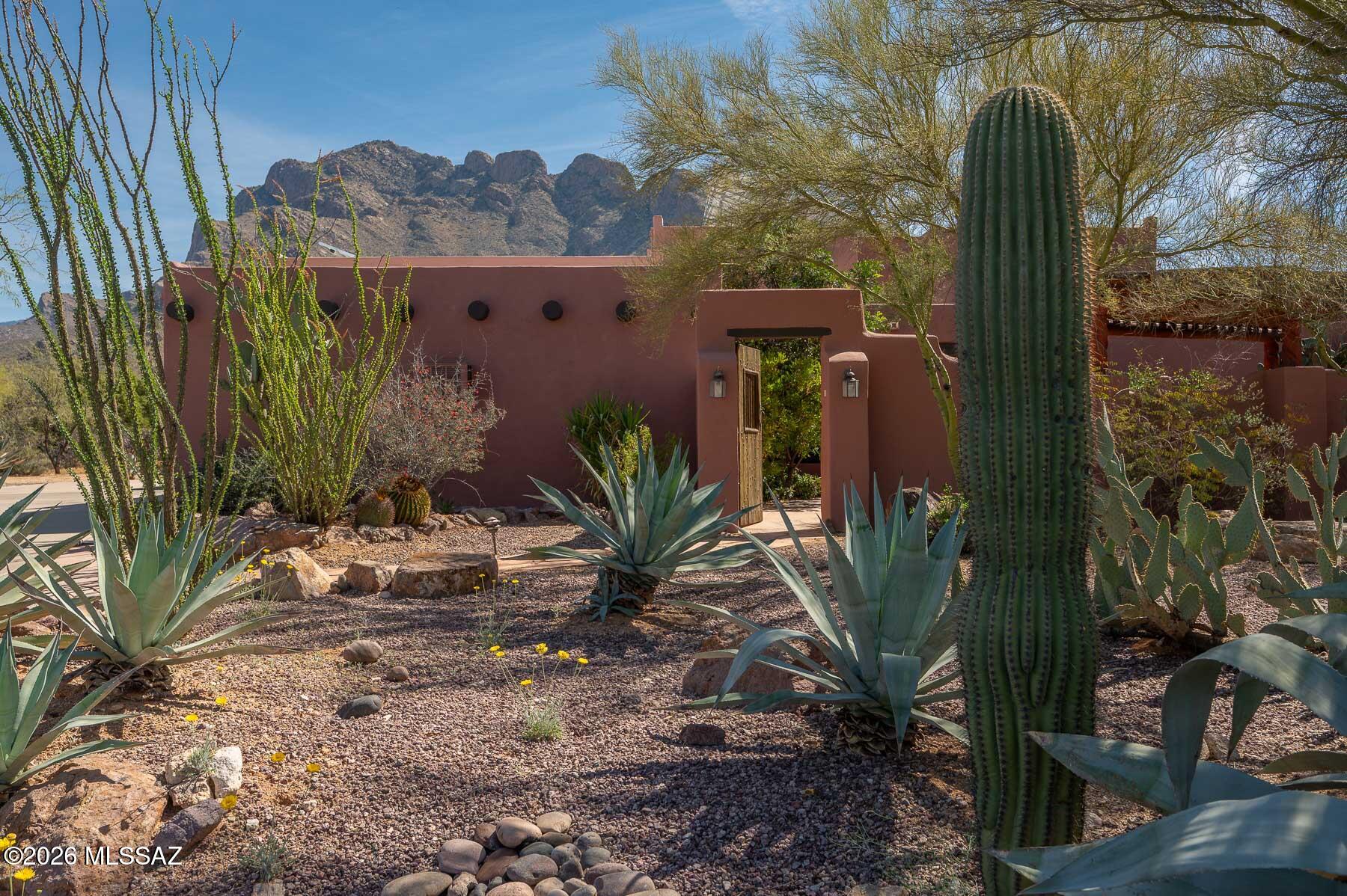 Enjoy stunning mountain views from this spacious 4 bedroom, 2 bathroom home with OWNED SOLAR and triple pane windows, for energy savings. The property includes a 3 car attached garage and an additional detached garage, offering ample space for vehicles, hobbies, or storage. Step outside to your private backyard oasis featuring a refreshing pool with a beautiful waterfall. Plus no HOA! A perfect blend of comfort, efficiency and scenic desert living.