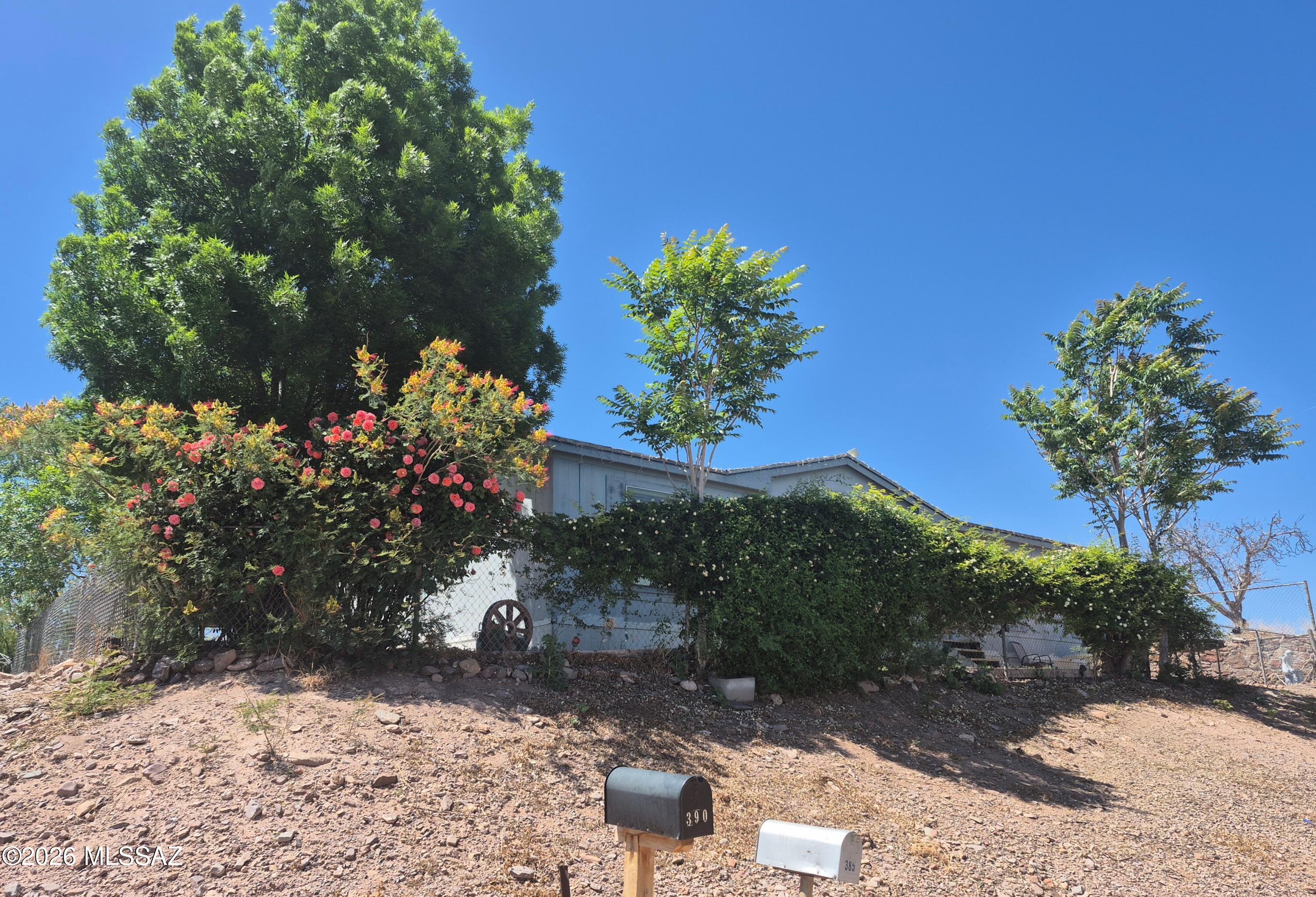 Come see this spacious 7 bedroom 3 bathroom house in Verde Lee! The home includes a permitted, finished addition. There are two HVAC units, two water heaters, and even two laundry rooms. All appliances are included, and property comes furnished.
Follow the driveway through the double gate and up the hill to a large area that could hold a shop or plenty of cars. Has a shed for storage.