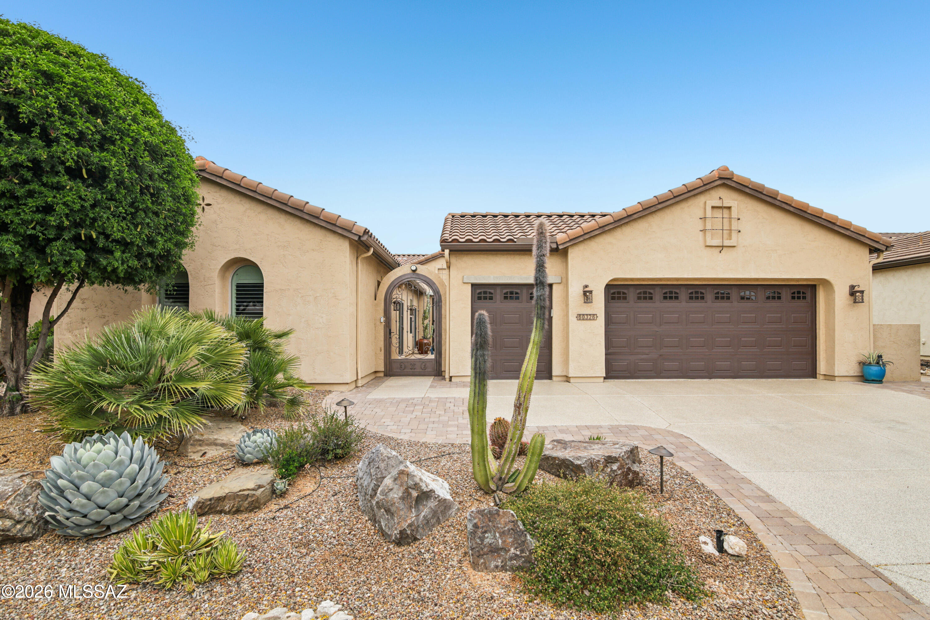 Exceptional Mirasol model w/casita on a PREMIUM GOLF Course lot. This immaculate professionally decorated home includes an enchanting courtyard entrance with arched iron gate, casita off courtyard with private entrance plus 2 bed & den, 2 ½ baths in main house.  Wonderful great room concept with tons of natural light give it an open and airy feel. Large center slider creates the ideal indoor/outdoor living. Gourmet chef's kitchen includes Beech wood cabinetry, granite counters, stainless appliances, wine fridge, and large island perfect for hosting. Home features comfortable living spaces with stylish finishes allowing the perfect setting for relaxing and entertaining. The best part is stepping out into your private resort style backyard complete with amazing views,extended covered patio, with motorized sun shades, outdoor gas fireplace, refreshing spool, gorgeous waterfall feature plus professional landscaping. Over $240,000 in upgrades including beautiful maple hardwood floors in main areas, primary closet system, automatic interior window coverings, cabinets in laundry room, water softener, 2 ½ car garage incl. golf cart garage, 4' garage extension with built in storage cabinets, workbench...plus golf cart included.  This gorgeous home is a true stunner in the popular 55+ gated community of Saddlebrooke Ranch.  This home has it all!