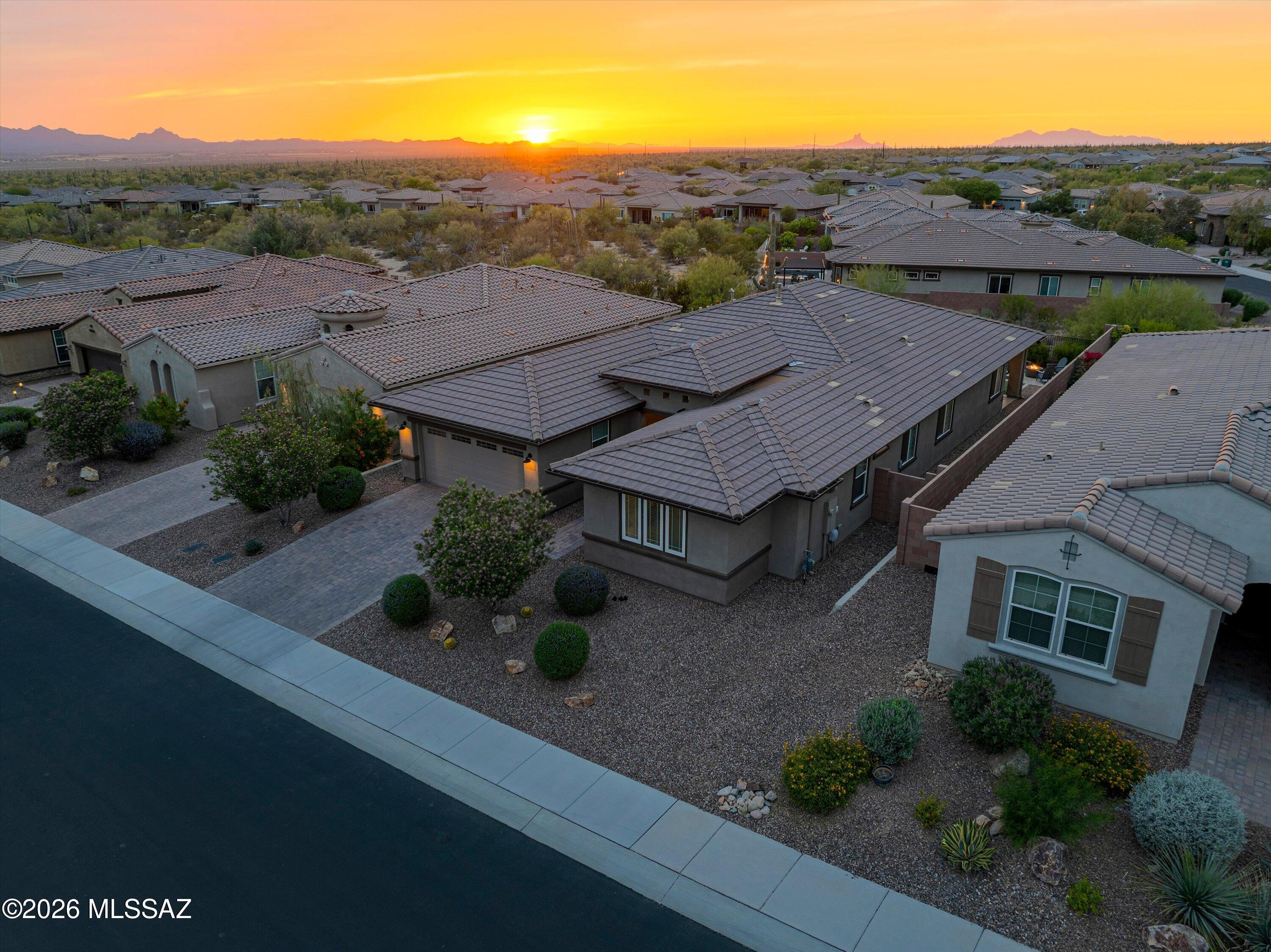 Refined Sonoran Living | 4 Bed + Den Home in Dove Mountain (Marana, AZ)

    Key Specs: 4 BED | 2.5 BATH + DEN | 2,519 SQ FT | 3-CAR TANDEM GARAGE 

    Welcome home to an exceptional residence that redefines move-in ready luxury. Skip the builder wait times and experience a property that is truly better than new construction. Located in the coveted gated Blue Agave community within world-renowned Dove Mountain (85658), this pristine single-story Ridgeview floor plan invites buyers to step inside and experience elevated desert living with high-end, thoughtful upgrades throughout.  Your New h
Home greets you with an expanded paver driveway and front walkway, 8-foot interior doors, updated designer lighting, and custom ceiling fans. FLEXIBLE INTERIOR DESIGN & ELEGANT DINING:

Discover a clean neutral designer palette anchored by 6x36 Hill House Natural wood-look porcelain tile across all primary living areas and baths. Double 12-lite French doors open to a light-filled den--perfect for an executive home office, media room, or optional 5th bedroom. Just up the hall, step into a dedicated dining room showcased by custom built-in cabinetry that adds refined architectural warmth and exceptional storage.

CHEF'S GOURMET KITCHEN & GREAT ROOM:

Come experience an expansive great room built for effortless entertaining, featuring a flush 110V floor outlet and seamless flow into a charming breakfast nook and chef-inspired kitchen. Your gourmet kitchen boasts a grand center gathering island, built-in desk, top-tier appliances, Reverse Osmosis water filtration, a Matte Black Kohler Cairn sink, and Moen oil-rubbed bronze hardware.

SPLIT FLOOR PLAN & RESORT-STYLE PRIMARY SUITE:

Three secondary bedrooms offer Level 3 "Sumptuous Cashmere" carpet with an 8lb pad, sharing a hall bath with floor-to-ceiling tile work. Your p
Primary retreat invites you to relax with serene a mountain view and a spa-like ensuite featuring a highly desirable extended-length walk-in shower with custom tile work, matching tile floor, and dedicated spa niche.

BACKYARD OASIS & MODERN TECH:

Step outside to experience your private desert sanctuary--complete with an extended covered epoxy patio, custom travertine patio, artificial turf, natural gas BBQ connection, rain gutters, and open view fencing to take in Tucson's famous sunsets. Includes whole-house surge protection, water softener, mudroom, laundry sink, and 3-car tandem garage.

THE DOVE MOUNTAIN LIFESTYLE:

Nestled in Marana, AZ near the Ritz-Carlton Resort, championship golf, scenic Tortolita Mountain hiking trails, dark-sky views, and top-rated Dove Mountain CSTEM K-8 School.