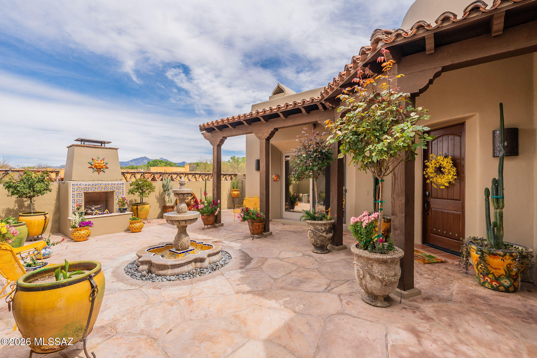 This stunning Santa Fe Style home located in the historical town of Tubac is perfectly positioned, backing up to the De Anza trail & Santa Cruz River.  It is graced w/ views of the Santa Rita Mountains & the distinctive Elephant Head.  Stepping inside the interior courtyard w/ a soothing water feature and tiled fireplace an easy place to rest and relax.  The Charming casita has privacy & comfort to all guests who stay & is a true extension to the southwest style of the main home.  Enter the home and take in the impressive circular entry w/ cupola ceiling,  with the beautiful Saltillo flooring & wood beamed ceiling in the Living room you can see how this home celebrates it's rich heritage.  The outdoor living space is truly the extension of the home's beauty.  The travertine floors stay coo cool in the hot summer months, 2 more soothing water features and a 4ft depth salt water & heated party pool also with a water feature. The most striking feature is the Covered outdoor living room with gas fireplace and the dining area serviced by a outdoor chef's kitchen, complete with a built-in BBQ, Pizza oven, dishwasher, refrigerator, TV and large island w/ slab granite. Enjoy our dark skies with  nighttime stargazing on the sky deck.  This home is not just a residence it's a retreat that encapsulates the spirit of Tubac's artistic heritage. List of furnishings available for a separate bill of sale.  Viking gas cooktop, Viking oven in main home kitchen.  Ample storage throughout.  Truly a one of a kind home.