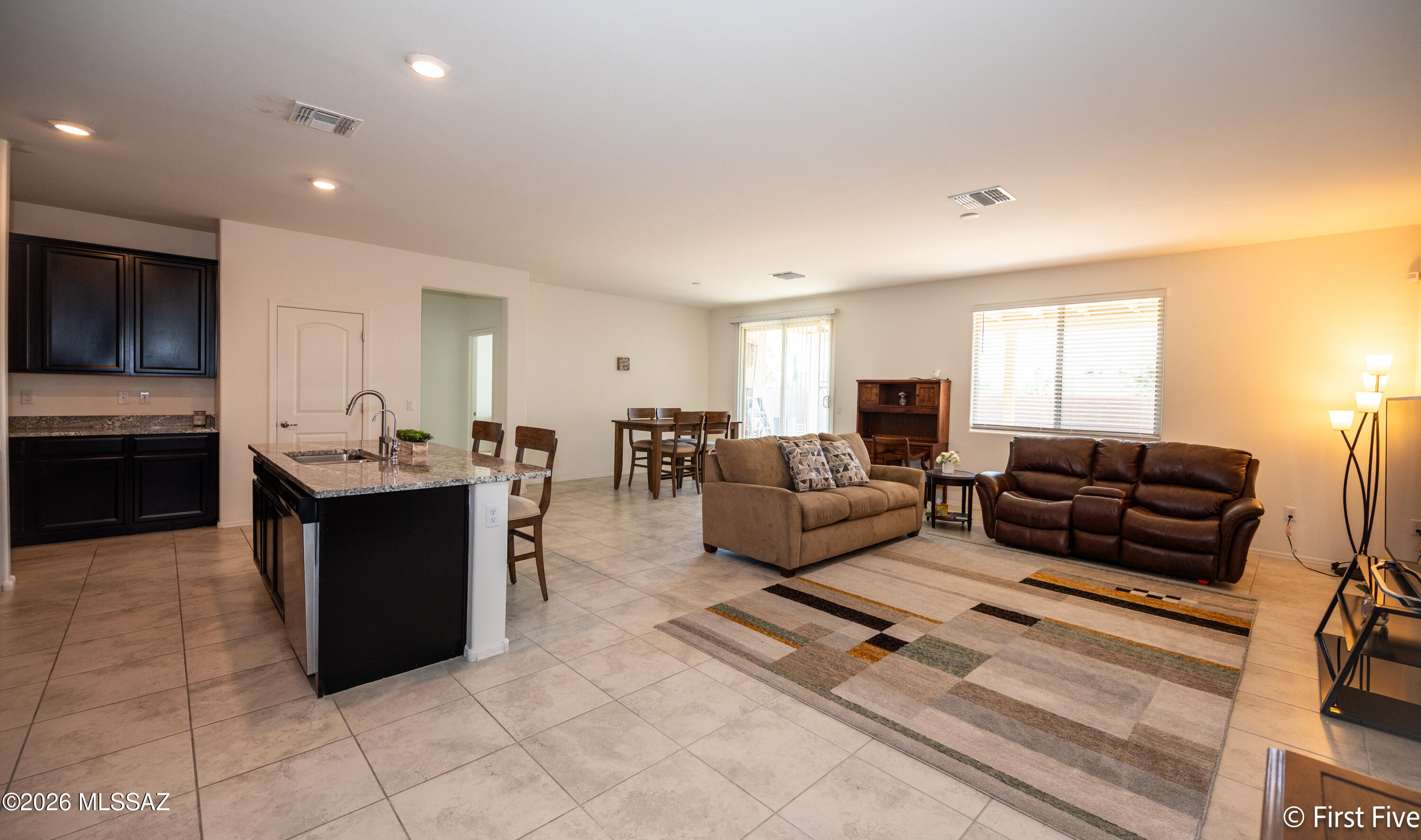 Move-In Ready with PAID SOLAR!! + Prime Location! Assumable VA Loan. 

Clean, single-story home in a well-kept neighborhood just minutes from Davis-Monthan Air Force Base. Open-concept floor plan with spacious living area, tile flooring in main spaces, and a modern kitchen featuring dark cabinets, granite countertops, stainless steel appliances, and a large island with bar seating. 

Oversized primary bedroom with plenty of natural light. Low-maintenance desert landscaping and solar panels help keep utility costs down.

Great layout. Great condition. Great location.