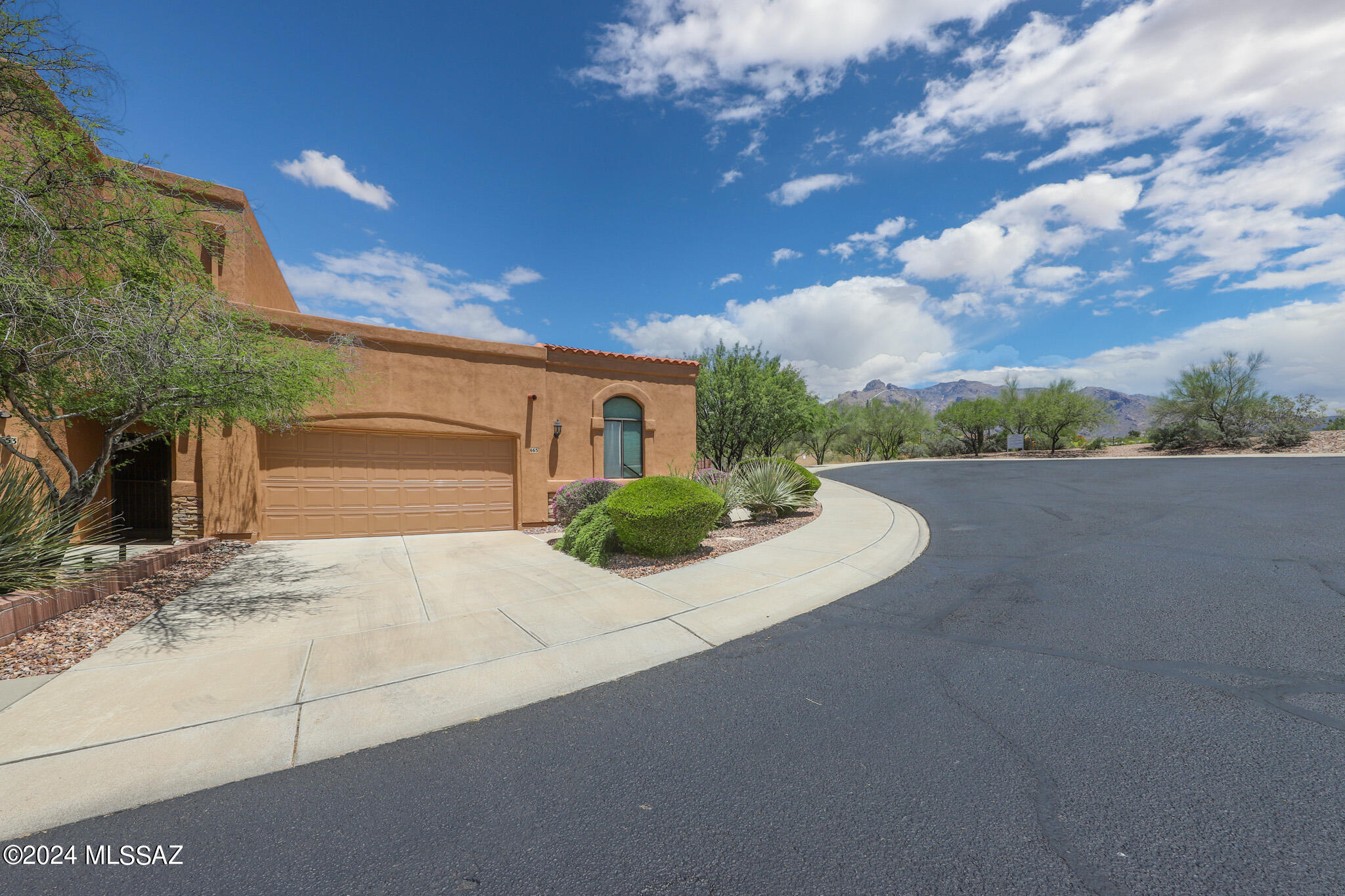 Nicely appointed 2 bedroom 2 bath plus den end unit in Tucson's Catalina Foothills offers a split bedroom plan, 2 car garage, all appliances including washer and dryer, gated courtyard entry, mountain views, and a cul-de-sac lot.  Community offers a pool and spa and convenience to shopping & dining including the popular La Encantada & St. Phillip's Plaza. **Do not disturb the tenant. Available 6/5/26. Owner approval is needed for all pets. A 48-hour notice is required to show.