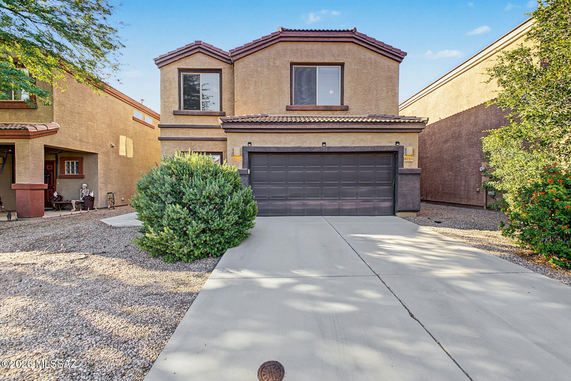 Looking for space that adapts to the way you live? This 5 bed, 3 bath home in the gated community of The Pines offers comfort, flexibility, and room to grow. The main level features an eat-in kitchen that opens to a large family room, creating a welcoming central space for everyday meals and entertaining. Also on the main level is a bedroom that works well as a guest room or private office, plus a full bathroom for added convenience. Upstairs you'll find four additional bedrooms, two full baths, and a generous loft. Use the loft as a media room, home gym, hobby space, or second living area. Built in 2014 with 2,173 sq ft, this home offers a thoughtful, versatile floor plan. The Pines is a gated community featuring a community pool and parks in both Phase One and Phase Two. throughout. Conveniently located near Arizona Pavilions and Tucson Premium Outlets, this home offers easy access to shopping, dining, entertainment, and everyday amenities. With its spacious floor plan and convenient location, this home is ready to welcome its next owner.