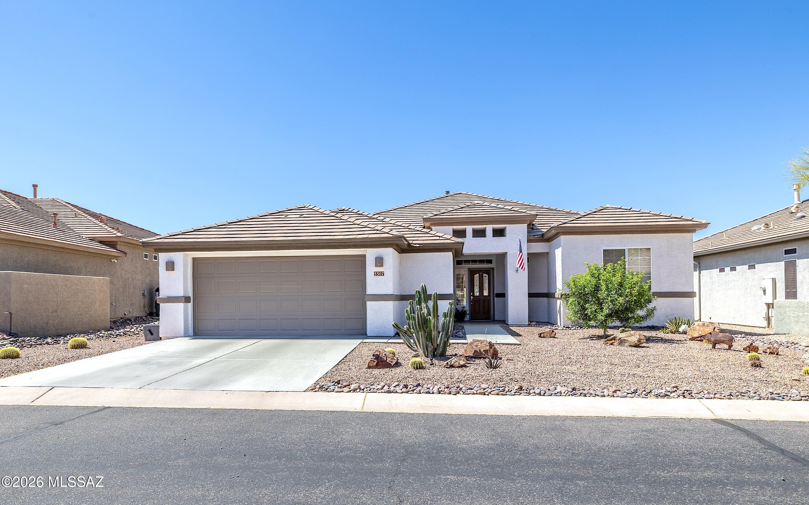 Beautiful, fresh, clean, light & bright Santa Rosa model. All tile flooring - abundant natural light. Wide open flowing floor plan.  Lovely epoxy entry walkway, front porch and back porch. Very extended length and width back porch - one of the most spacious in the subdivision. Built in BBQ station . Backyard fully fenced and has SW Marana city lights looking to the right.  Garage has a spacious golf cart bump out alcove.  Large bonus craft or office room w/abundant cabinetry - desk stations.  Water heater replaced roughly 4 years ago - HVAC changed out @ 2017. Home is very crisp and move-in-ready.   Come view the fresh clean natural light that glows throughout this beautiful home.