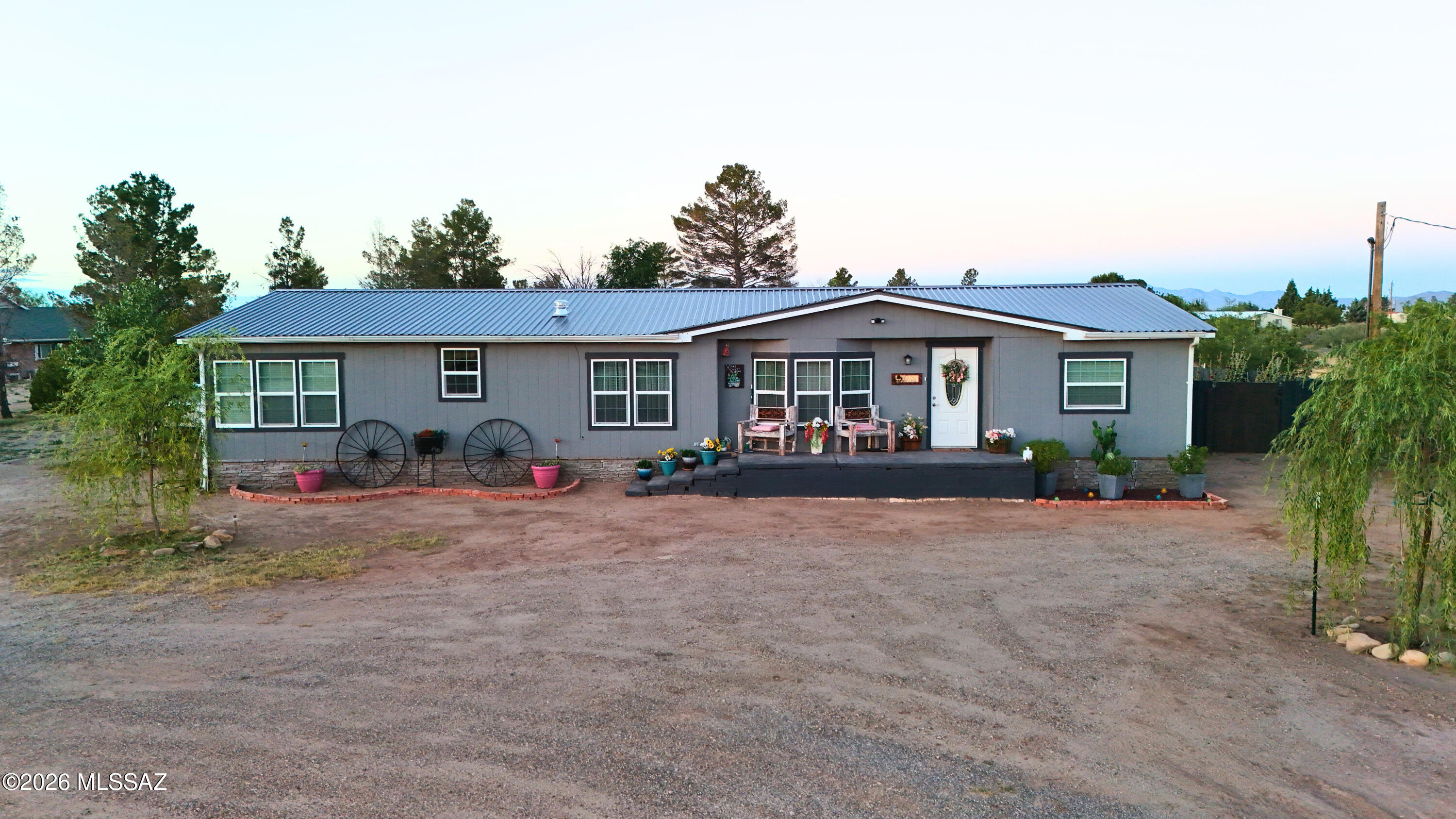 Start over without having to do all the work! This beautiful home has been completely redone, from the bottom up, including -but not limited to- new HVAC (including new ductwork under house), new flooring throughout the house, new tubs & toilets, new cabinets, new (beautiful!) granite countertops, new windows, new water heater, new back porch, new metal fence around back yard, new metal shop, new bladder on the well.    This house was redone with the intention of staying there forever, so it was all done well, and with so much heart!  All the tiny little details make it feel like home.

There is a metal roof on the home, and on both outbuildings: the metal shop, and also the ''She Shed''.  The She Shed has water and electricity to it, and was once used as a dwelling. The backyard is completely enclosed by a metal fence that provides privacy to more fully enjoy the back patio and porch area.  New trees and bushes dot the property - it is stunning!  

Come see this beautiful home on an acre of land in an outstanding location!  Definitely off the beaten path, but amazingly convenient and close to town. 

The current owner stays very comfortable in this all-electric efficient home!