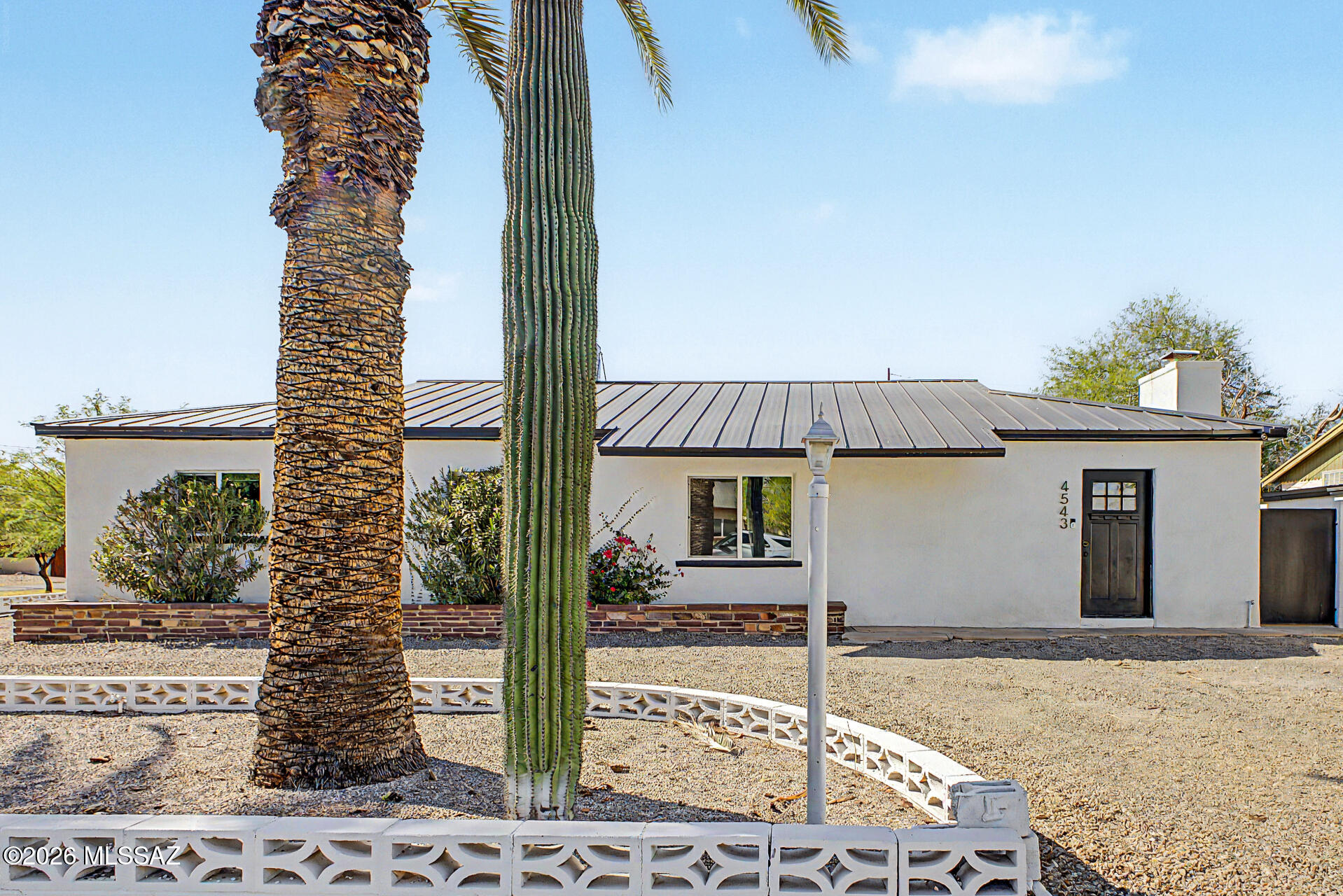 Seize the opportunity to own this stunning single-story home with POOL situated in a prime CORNER LOT! Explore the inviting living areas designed with comfort in mind, featuring tile flooring, contemporary lighting, stylish accent walls, a fireplace to add warmth, and a neutral palette that promotes a modern feel. The impeccable kitchen awaits your culinary adventures, equipped with espresso cabinets, tile backsplash, granite countertops, and stainless steel appliances. Get a good night's sleep in the primary bedroom, including a private bathroom with double vessel sinks and a huge closet for all your belongings. The beautifully landscaped backyard is an entertainer's dream, complete with a covered patio ideal for casual dining and relaxation, Owner/AGENT ample seating space with flagstone flooring, artificial grass, a putting green, and a sparkling pool! This gem offers something for everybody! Don't miss it!