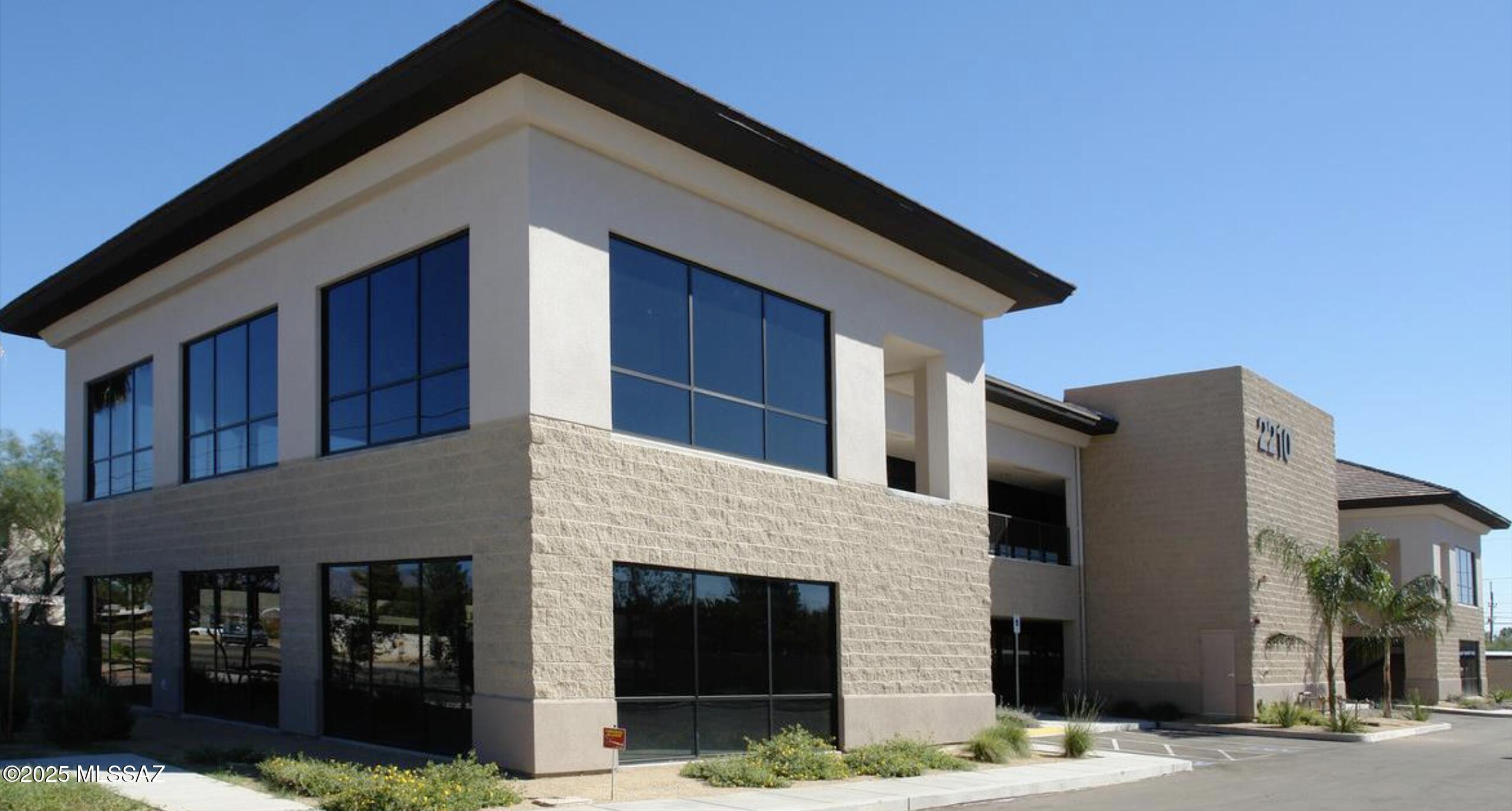 The best way to appreciate this beautifully appointed office space is to see it in person. Previously occupied by a global mining company, no expense was spared in the build out. From expansive offices to bull pens, collaborative spaces and conference rooms, all complimented by the floor to ceiling windows which bring in the natural beauty of the Catalina Mountains. With a central location at Fort Lowell and Campbell, it has excellent access to all corners of the city. Secured by an automatic gate and key card access. Abundant covered parking. The second floor is served by an elevator.  

New owner can occupy up to 7,250 sq ft and collect income from the ground floor tenant.  Seller may negotiate a lease and sell the property as an investment depending on the purchase price.