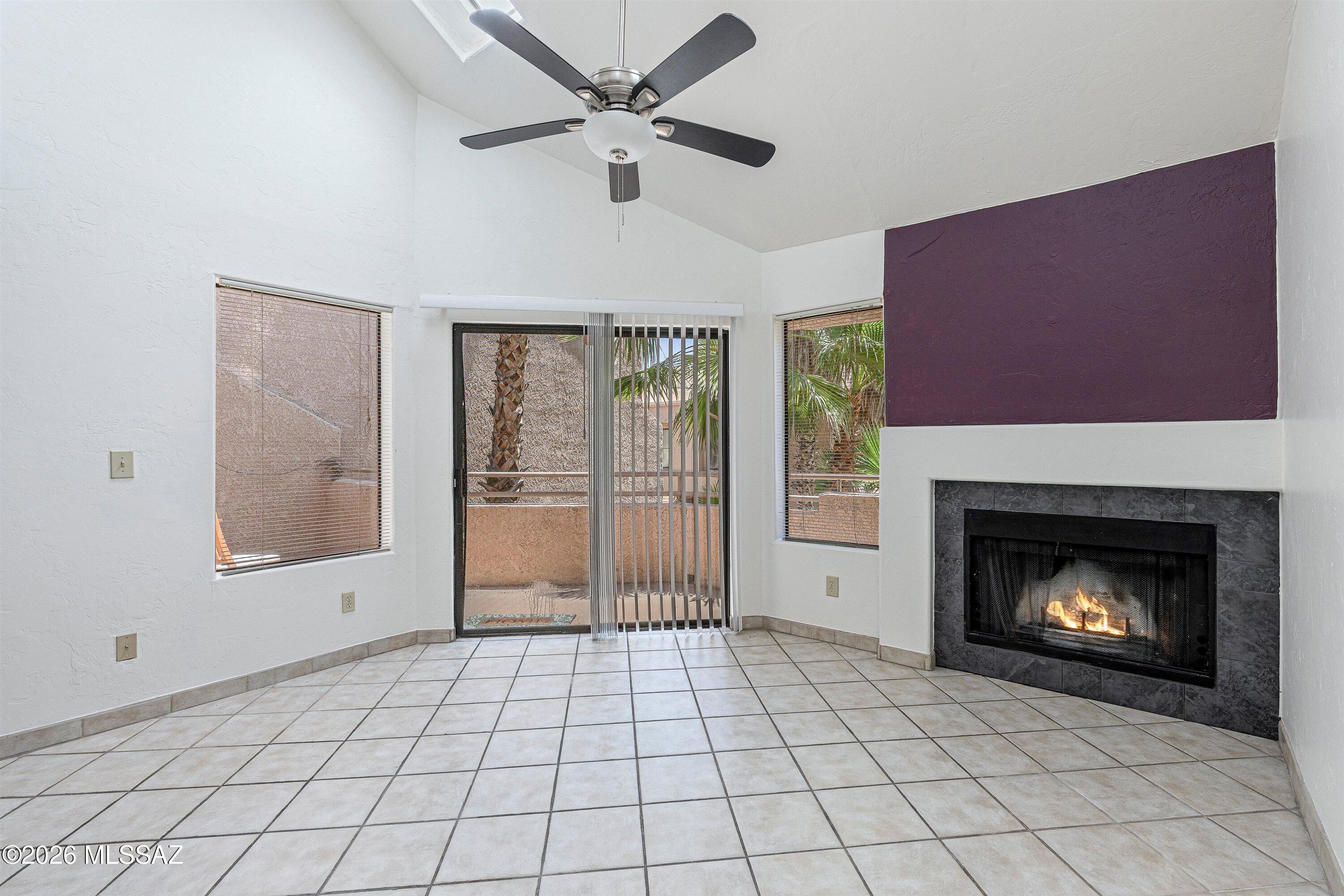 This spacious 1,362 sq ft Catalina Foothills condo features 2 bedrooms, 2 baths, plus a versatile den that could serve as a third bedroom with the addition of a closet. Soaring vaulted ceilings, abundant natural light, a loft-style primary suite, split-bedroom design, and a cozy wood-burning fireplace create a warm and inviting living space. Enjoy a private balcony overlooking lush community landscaping. Dakotah Hills residents enjoy a gated community with pool, spa, and covered parking. HOA includes water, sewer, trash, roof maintenance, termite treatment, and exterior pest control.