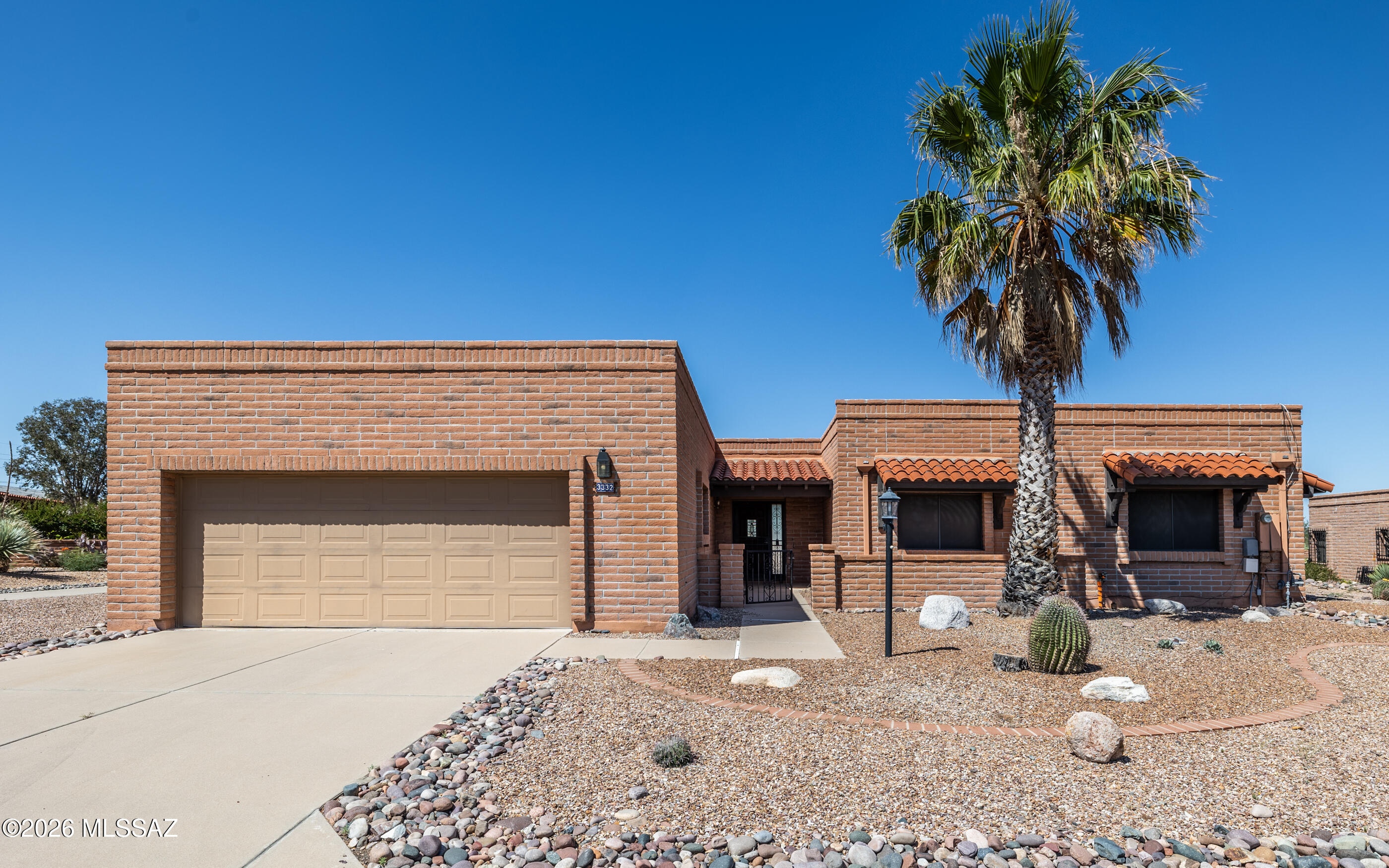 Enjoy the Fabulous Mt Views everyday from this extended large lot from both the rear and front of this home! This 2 BD, 2 Bath home has large comfortable lving areas with a fireplace and a coffee;bar area.Walk out the double sliding glass doors from both the LR and Master BD to the patio with views of the Mts!. Low maintence exterior as both front and rear patios are brick pavers. The extended 2 car garage, has a storage area, and a sink. Enjoy all the ammenities of the GVR, as this home is a deeded member.
