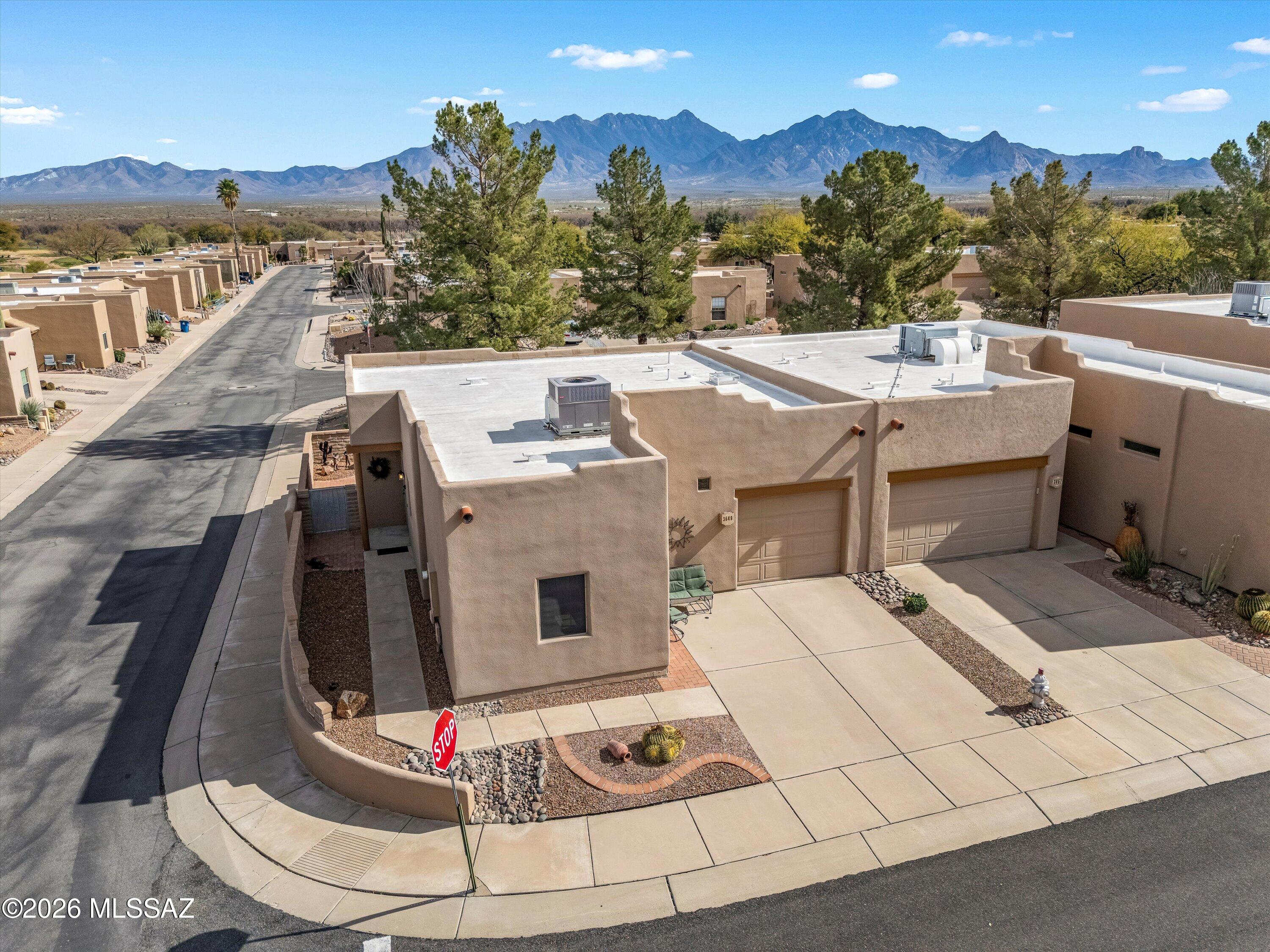Welcome to this beautifully maintained 2BR/2BA townhome in The Springs at Santa Rita, offering1,108 sq ft with mountain views. Features include a small office, 1-car garage, fireplace, 6 -year-old Culligan water filtration system and private back patio with raised privacy wall. Sold Fully furnished and move-in ready. Within walking distance to the GVR pool and amenities. Ideal for full-time or seasonal living.