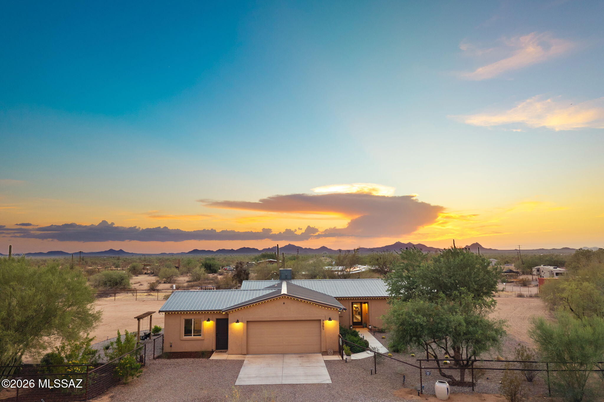 SELLER WILL GIVE SELLER CONCESSIONS FOR RATE BUY DOWN WITH ACCEPTED OFFER ; 2021 CUSTOM HOME ON 2.09 ACRES WITH MOUNTAIN VIEWS, GUEST SUITE & UNATTACHED STUDIO/BUNK ROOM -- NO HOA -- HORSE PROPERTY. This beautiful property offers 2.09 acres total, including the adjacent 1.09-acre parcel, which is included in the purchase price. 

This Home Features 4 bedrooms and 2 bath in main home. Guest quarters features 1 bed - 1 bath. Bunk room has studio - full bath. Main home has open floor plan with split bedrooms, kitchen with quartz counters, custom back splash, island and built in buffet for coffee station. Maintenance free scored concrete stained flooring thru out, metal roofing, wood fenced back yard, , tack room, and 3 large stalls.