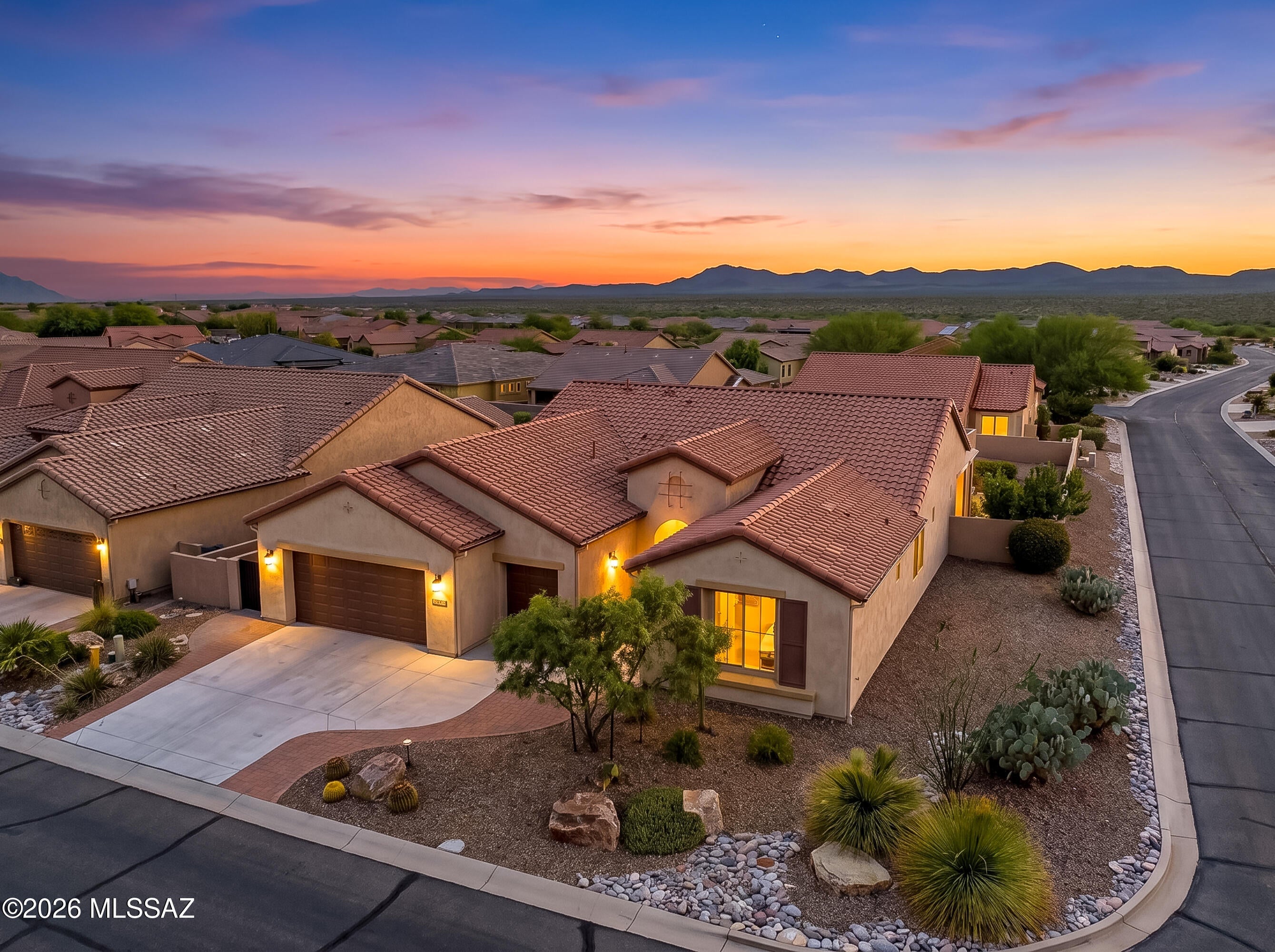 Welcome to this beautifully maintained Cortez, ideally situated on a premium .23-acre corner lot in the highly desirable active adult community of SaddleBrooke Ranch. Offering mountain views, a spacious fully fenced backyard, OWNED SOLAR with Tesla Powerwall battery backup, and room to create the pool of your dreams, this move-in-ready home combines comfort, efficiency, and the exceptional Ranch lifestyle. The thoughtfully designed split-bedroom floor plan offers approximately 2,000 square feet of inviting living space with 2 bedrooms, 2.5 baths, a spacious den ideal for a home office or potential third bedroom, a separate dining room, and tile flooring throughout with no carpet! At the heart of the home is the expansive island kitchen featuring quartz countertops, upgraded cabinetry, stainless steel appliances, abundant storage, and generous prep space. Open to the spacious great room, this light-filled gathering space is perfect for entertaining friends or simply relaxing at home. The refrigerator is included, and the separate laundry room features a utility sink plus included washer and dryer for added convenience. Retreat to the spacious primary suite with a generous walk-in closet featuring shelving and ample hanging space. The ensuite bath offers dual vanities and an oversized walk-in shower with built-in seat. Privately located on the opposite side of the home, the guest suite features its own ensuite bath and walk-in closet, creating a comfortable retreat for visiting family and friends. A separate powder bath provides additional convenience for guests. Step outside and embrace Arizona living on the covered patio with exterior roller shades, overlooking the beautifully landscaped, fully fenced backyard with views toward the Catalina Mountains and Mt. Lemmon. With plenty of room to entertain, relax, garden, or design a future pool, this outdoor space is ready to become your own private desert retreat. The oversized 2-car garage plus separate golf cart garage provides excellent parking and storage and features a finished epoxy floor, 50 amp outlet for EV charging, and mini split air conditioner. Even better, the owned solar system paired with Tesla Powerwall battery backup delivers valuable energy efficiency and adds peace of mind. All of this is just minutes from SaddleBrooke Ranch's incredible resort-style amenities, including championship golf, pickleball, tennis, fitness, dining, pools, and the Ranch House. Beautifully maintained, energy-smart, move-in ready, and ideally located--this Cortez offers the Arizona lifestyle you've been waiting for. Come experience it for yourself!
