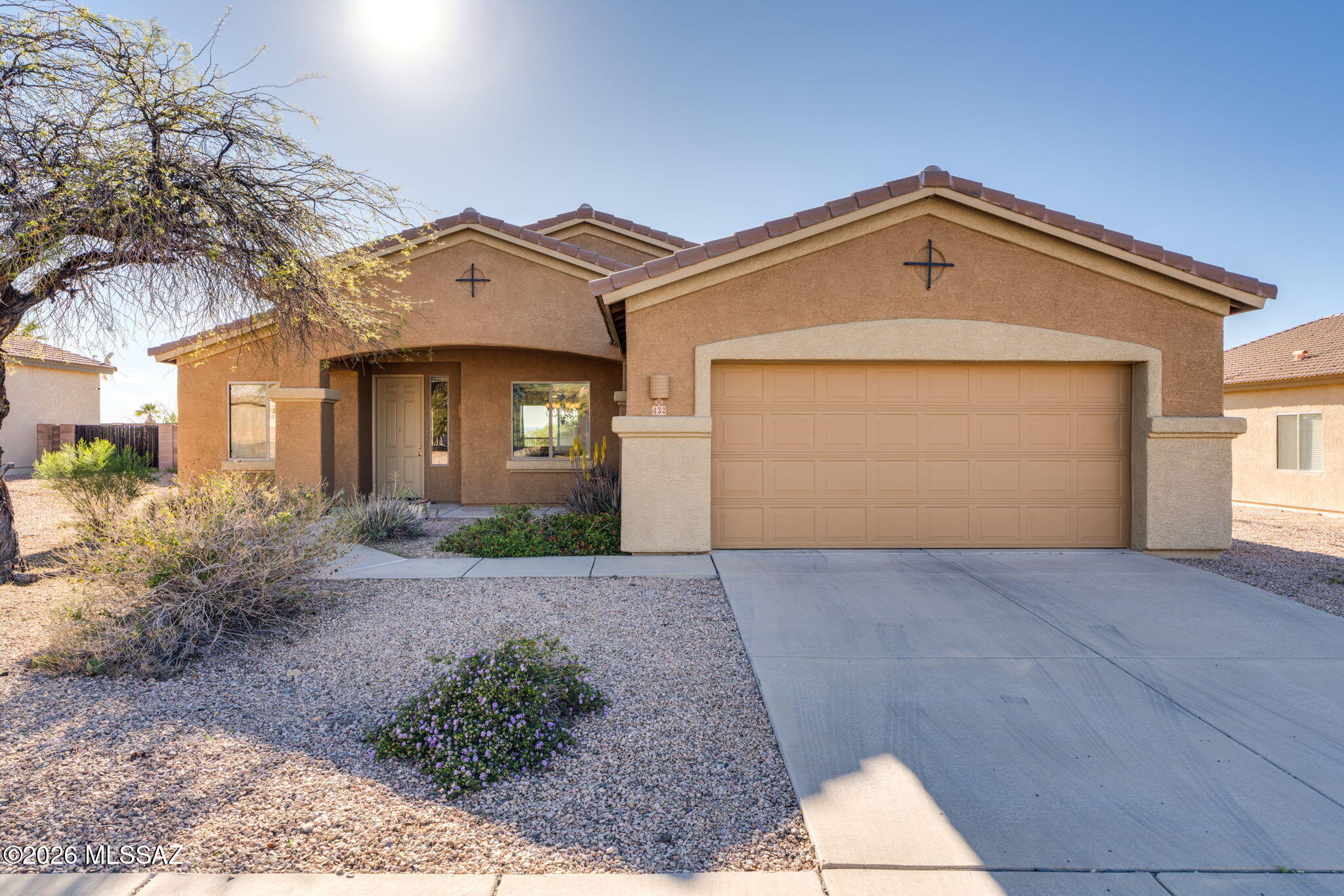 Nestled along the foothills of the Santa Rita Mountain range is this 3B/2Bath bright, open & split bedroom floor plan with amazing views off the back covered patio where you can enjoy sunsets, mountain views and city lights! This Vail School District home has high ceilings (with cove detailing in the dining area), beautiful wood laminate flooring throughout the main living areas, a large kitchen w/ separate breakfast area and pantry closet.  The oversized primary bedroom has a large walk-in closet and the bathroom has separate soaking tub and shower. Exterior painted in 2025! Make this home yours today!