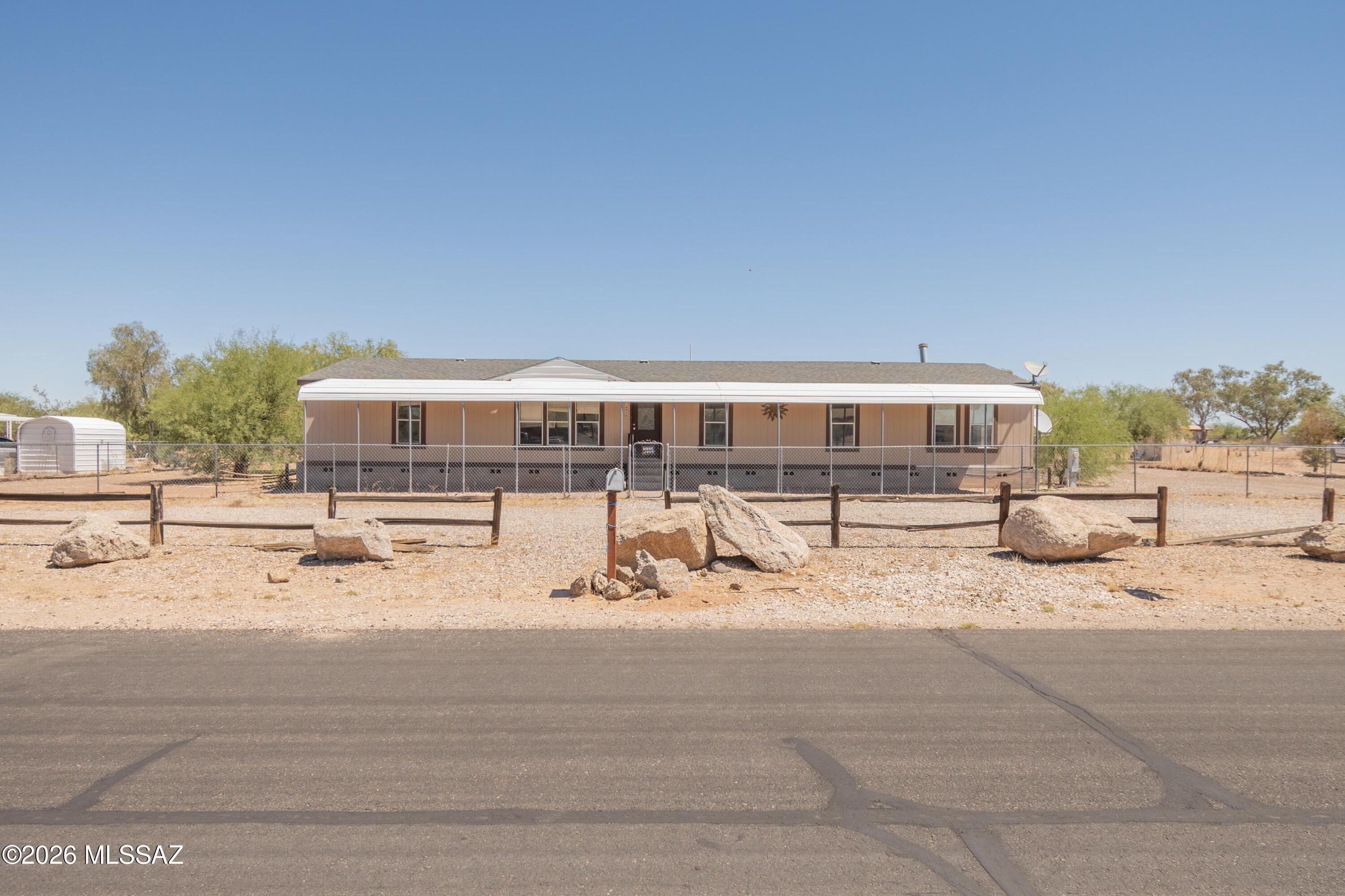 Experience wide-open skies, breathtaking sunsets, and peaceful country living! Set on a spacious 1 acre lot, this property offers room to roam. The entire lot is fenced, horse friendly, and on a paved road! Space for toys & animals, plus a detached 2-car garage and RV hookup. 

With almost 2300 sq ft of living space ready for your personal updates, this home is full of opportunity to create something truly your own! Tons of potential to put in your own sweat equity! Large kitchen, open concept, & split bedroom floorplan! HUGE bonus room that could be a family room, office, or 5th bedroom. 

Sold as-is: needs new HVAC unit & complete refresh throughout. Seller will consider offers between $247,900-$264,900 depending on terms & possible credit for new HVAC. Now offered with financing!