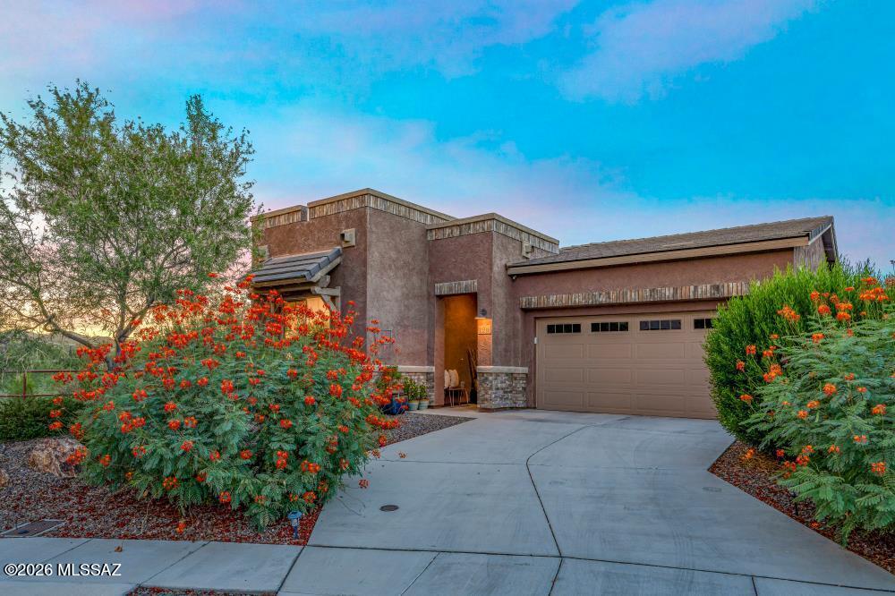 TURN-KEY ORO VALLEY LUXURY WITH INCREDIBLE CATALINA MOUNTAIN VIEWS! This beautifully maintained, newer-built home featuring 2 bedrooms, 2 bathrooms plus a versatile den, this home delivers a sophisticated luxury feel with stylish upgrades throughout. The show-stopping kitchen features gleaming quartz countertops, a gorgeous new hexagon tile backsplash, and beautiful finishes perfect for entertaining. The true WOW factor is the private rooftop viewing deck--your front-row seat to breathtaking Catalina Mountain views, colorful Arizona sunsets, and endless desert skies! Thoughtfully designed for comfort and easy living, the home also includes recessed ceilings, a soft water system, epoxy garage floors, under/above cabinetry lighting, artificial turf & upgraded plank tile floors inside.
