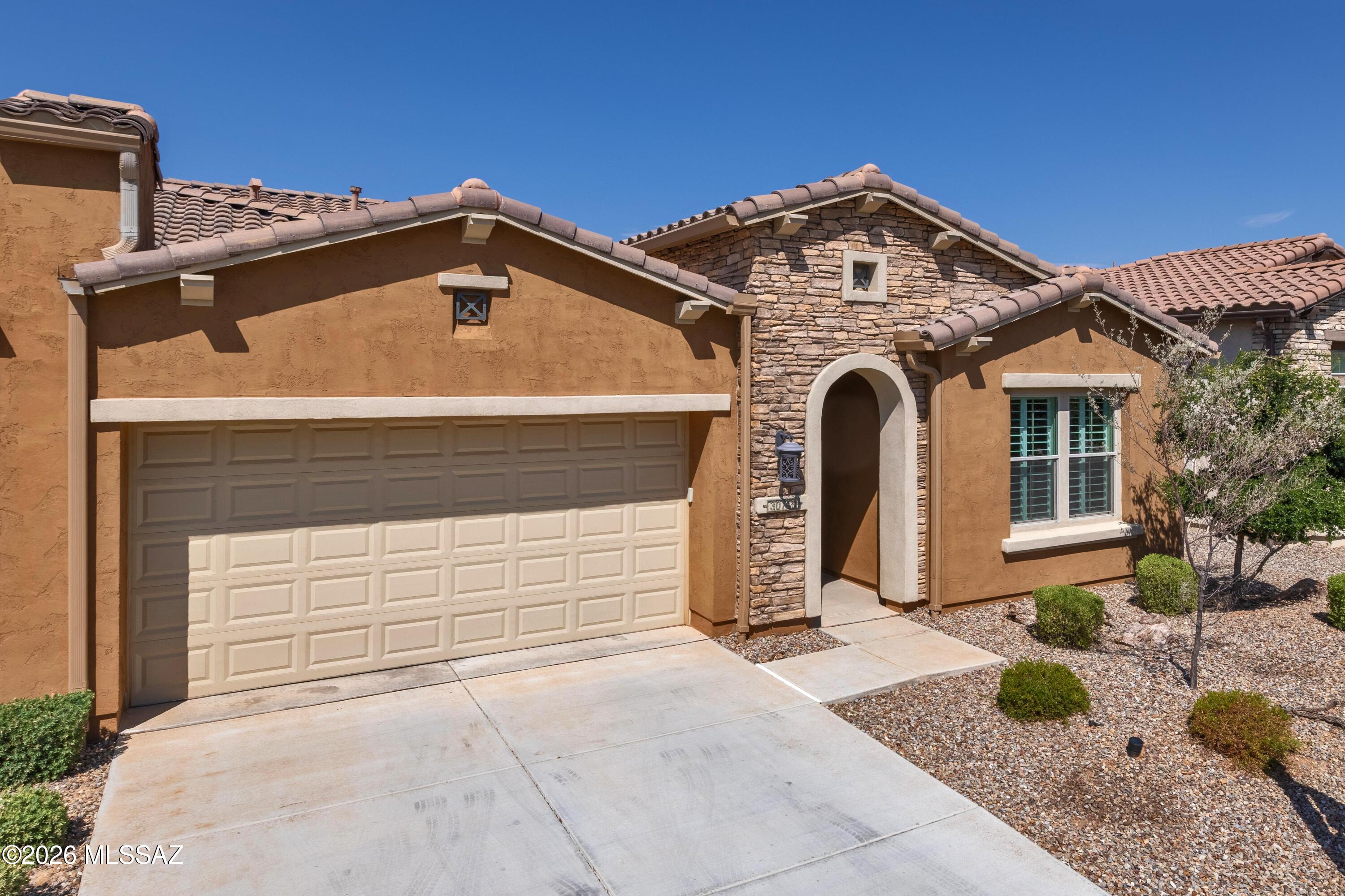 COMES FULLY FURNISHED! FURNITURE, BEDDING, DISHES, TV'S, BBQ'S, POTS & PANS - EVERYTHING THAT IS CURRENTLY IN THE VILLA. This is a beautiful 1707 Sq. Ft. Viva Villa Exterior Design __ built in 2020 that looks over a gorgeous Arroyo with a walking path.  This home includes 2-Bedroom En Suites, Great Room w/Media Alcove, Dining Area, Spacious Den, Grand Kitchen Island w/Walk-In Pantry, Separate Laundry Room, 274 Sq. Ft. Covered Outdoor Living Space, Deel 2-Car Garage, 9' & 10' Ceilings, and a 214 Sq. Ft. Enclosed Private Courtyard with gate.  The buyer has the incredible option of buying this unit and the attached unit as both are owner by the same individual = truly an investor's dream!