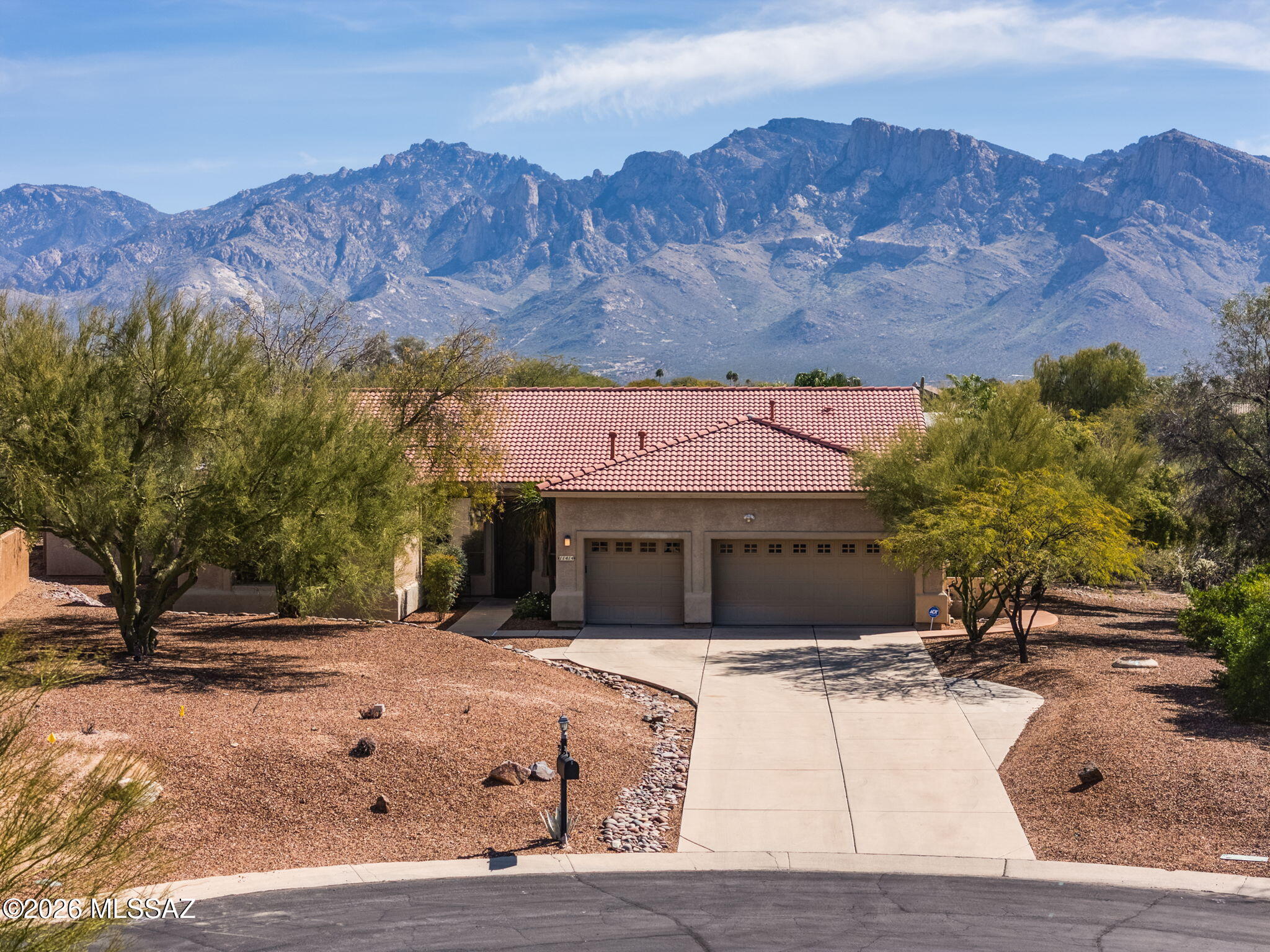 Enjoy Catalina Mountain views from this well maintained 4BD/4BA Oro Valley home (3,500 sq ft) in Desert Vista on .87 acres. Open-concept layout w/ large windows that deliver stunning views. Spacious kitchen island anchors easy entertaining. A den & a sizeable multi-use room w/ private bath & separate exterior entrance. The updated primary suite includes dual vanities, separate tiled shower & x-large walk-in closet. Three additional bedrooms & a hall bath anchor the opposite wing for privacy. Home has new LPV flooring and interior paint. Out back, entertain or unwind on the deep extended travertine covered patio that overlooks the private east-facing yard with a pool & hot tub to complete the setting.  Close to Parks, Oro Valley Community Center, Loop multi-use path, shopping & dining.