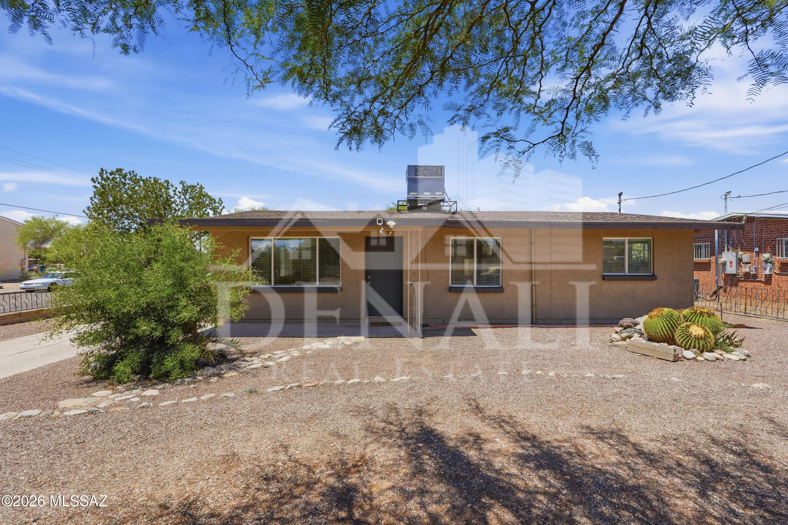 No Application Fees! Single level 4 bedroom, 2 bathroom corner lot Tucson home with numerous upgrades throughout. This home features tile flooring throughout with no carpeting, upgraded window blinds, neutral paint throughout, ceiling fans, and excellent natural lighting. Spacious floor plan includes a large front living room and separate rear family room with wood-burning fireplace providing substantial additional living space. Updated kitchen features extended countertop space, upgraded cabinets, dining area, gas range, stainless steel appliances, refrigerator, dishwasher, microwave, and bonus wine refrigerator. Oversized primary suite includes walk-in closet and attached private bathroom. Large covered backyard patio and additional storage room provide excellent outdoor living and storage space. Easy to maintain desert landscaping with garden planters on a larger corner lot.

Convenient central Tucson location close to shopping, restaurants, parks, schools, University of Arizona, medical facilities, and entertainment. Easy access to major Tucson roadways and nearby employment corridors throughout the area

All Denali Real Estate residents are automatically enrolled in the Resident Benefits Package (RBP) for $55.00/month which includes Renter's Liability Insurance, Credit Building to help boost the resident's credit scores with timely rent payments, up to $1M Identity Theft Protection, HVAC air filter delivery (for applicable properties), our best-in-class resident rewards program, and much more!