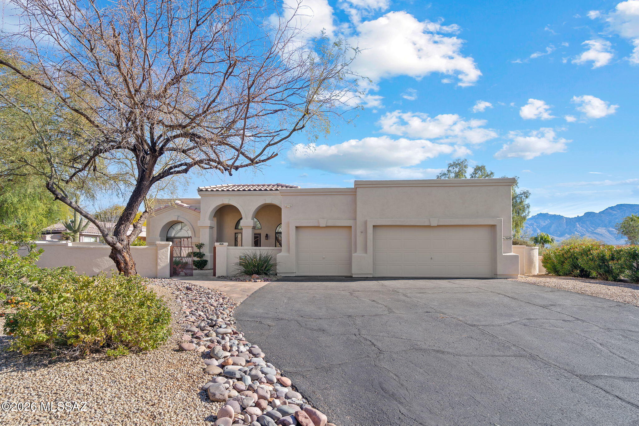 This beautifully updated 4-bedroom, 2-bath home sits on nearly half an acre and offers the perfect blend of modern upgrades and outdoor living. The fully remodeled kitchen features new appliances, quartz countertops, and a striking waterfall-edge island ideal for entertaining. Both bathrooms have been upgraded with new vanities, while tile flooring replaces carpet in two of the guest bedrooms and great room for a cohesive, low-maintenance finish. The exterior has been freshly painted, enhancing curb appeal. Step outside to a spacious backyard designed for enjoyment, complete with a heated pool and spa, putting green, and sweeping mountain views—ideal for relaxing or hosting guests. A rare opportunity to enjoy space, style, and resort-like amenities.