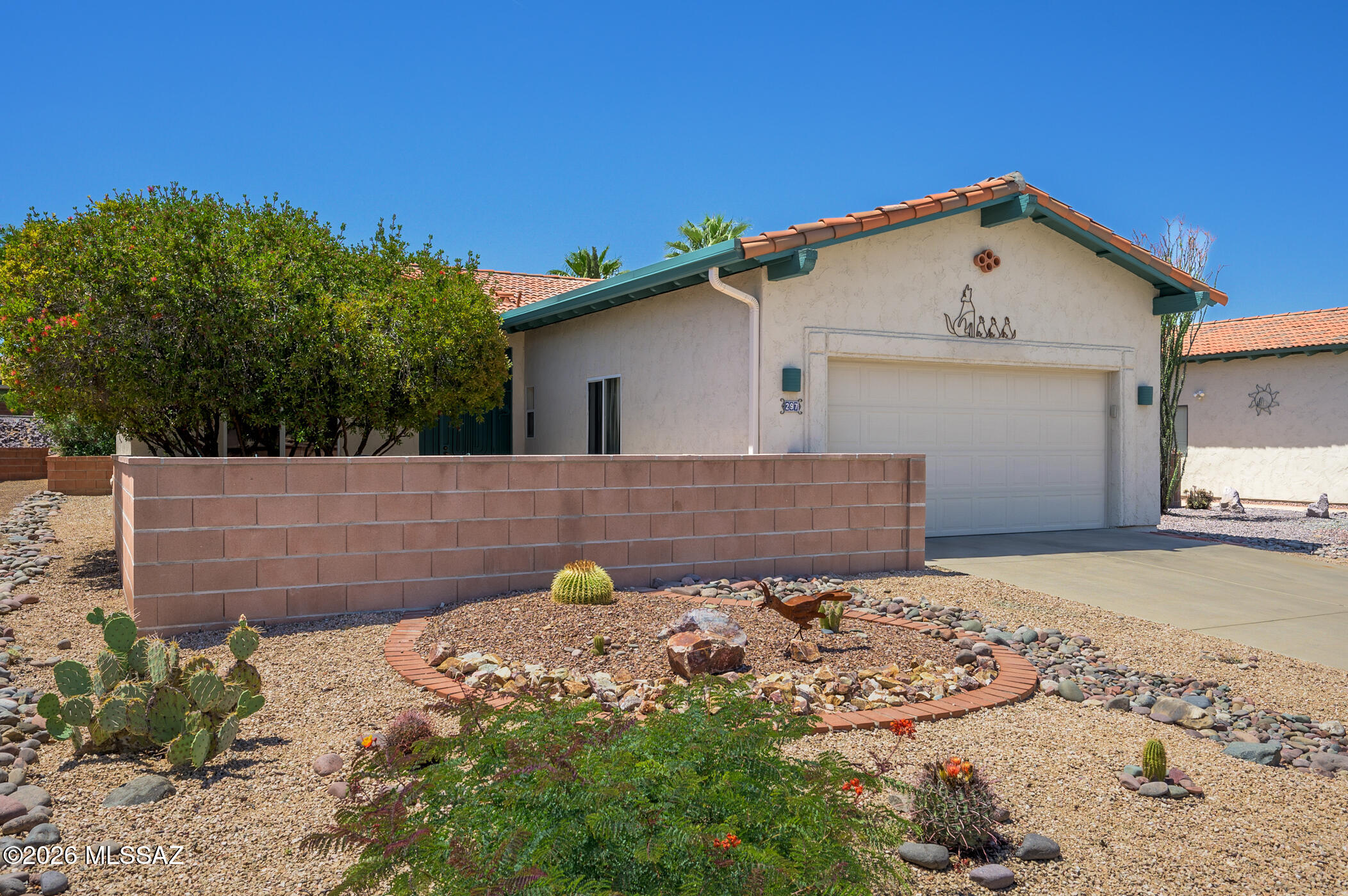 Welcome to the perfect retreat for active retirees ready to embrace the lifestyle of Southern Arizona. This well-kept residence offers just the right balance of comfort and convenience, making it ideal for those looking to downsize, acquire a seasonal vacation getaway or purchase an investment property.  As you approach, mature trees and a private front courtyard greet you, providing a serene spot to appreciate the views of the Santa Rita Mountains. Step inside to discover an inviting open floor plan enhanced by 10-foot ceilings, which foster a bright and airy ambiance throughout the living areas. The efficient U-shaped kitchen features stainless steel appliances, a pantry closet, and provides a seamless flow to both the dining area and living room--perfect for entertaining and keeping conversations lively. The design of the residence features a split bedroom layout which ensures privacy, with the primary ensuite conveniently located at the rear of the home. Enjoy the advantages of a dual-sink vanity, a separate shower room, and a spacious walk-in closet.  Unwind on the screened rear patio, a tranquil spot to cool off and relax after a day engaging with nearby recreation amenities--one of Green Valley's premier centers is just a few blocks away. Whether you're seeking an active community, mountain views, or simply a cozy place to call home, this inviting property delivers the quintessential Green Valley experience. Don't miss your opportunity to start your next chapter in sunny Southern Arizona!