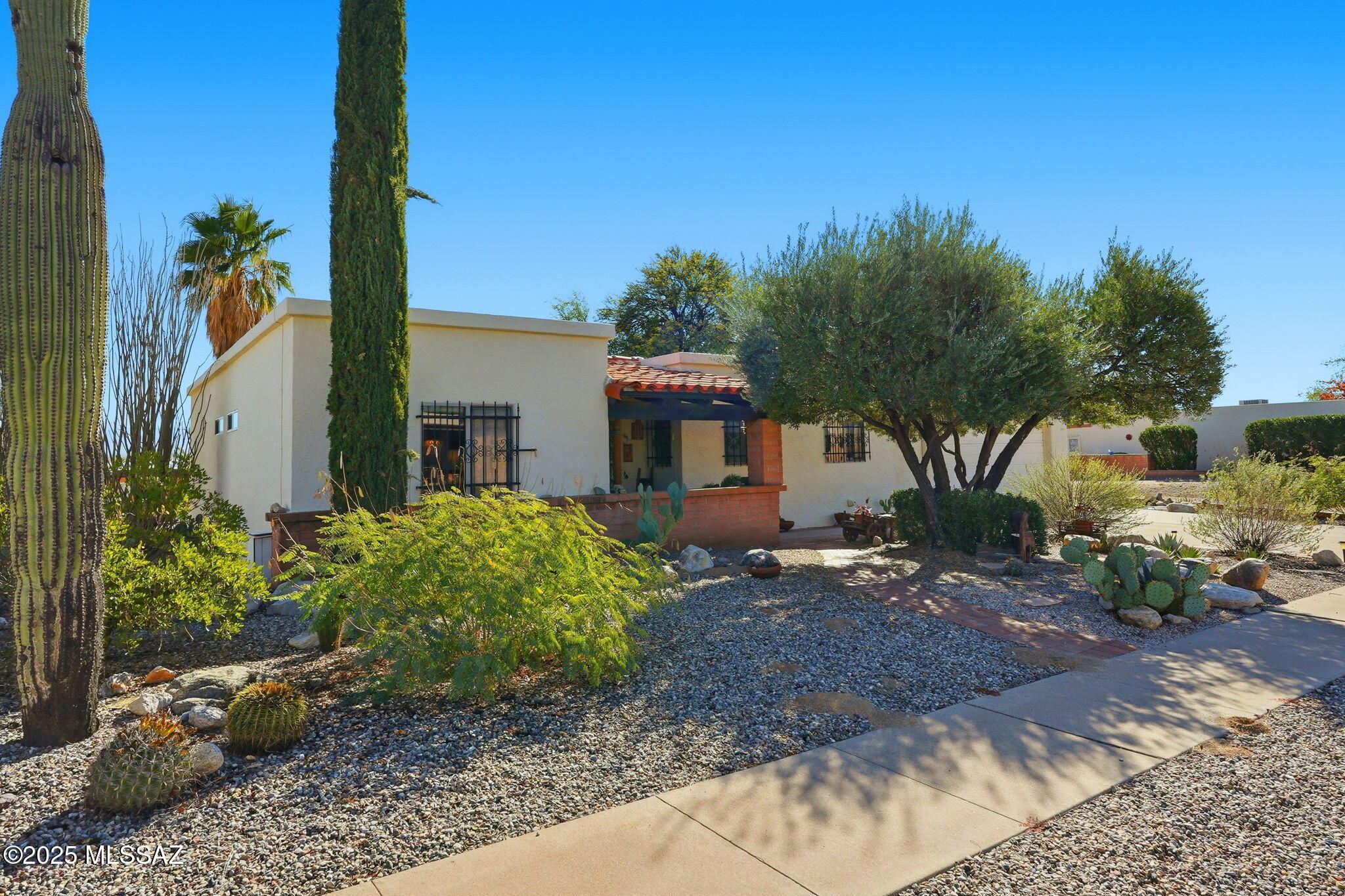 What's not to love in this inviting updated home: Outstanding Mountain view to enjoy on your patio while watching the sunrises/sunsets! Lovingly updated with  dual pane windows throughout the home, Corian counters, pull-out drawers in  kitchen. The Arizona rm with heating and cooling plus electric fireplace adds approx 190sq ft to the 1110 sq ft to total 1300 sqft of living area. Amenities continue with 17 X 9 ft workshop, laundry rm with sink & storage, plus washer and dryer. A pleasant front porch welcomes with a Southwest flare. Outback, enjoy the yard & patio. Plus you can purchase all furnishings that include Laz-Z-Boy & other fine furniture by separate bill of sale for $2000.00 that includes patio set & all tools in the shop.  Low $35 Annual HOA dues ! County records show the house sq footage as 1110. The added Arizona room is approx 190sq ft and is heated and cooled so total heated and cooled sq footage is actually 1330 sq ft.
