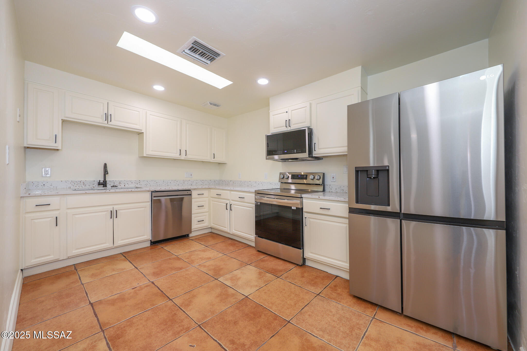 Spacious and modern, this 3-bedroom, 2-bath unit offers comfortable living with stylish upgrades. Tile flooring throughout ensures durability and easy maintenance, while the updated kitchen features sleek stainless steel appliances, ample cabinetry, and generous counter space--perfect for cooking and entertaining. Enjoy the convenience of an in-unit washer and dryer, making laundry simple and hassle-free. The fully enclosed side yard provides privacy and a great space for relaxation or outdoor activities. Conveniently located near TMC, Pima Medical Institute, and a variety of shops, this property combines comfort, style, and accessibility. Don't miss the chance to make this beautiful home yours!