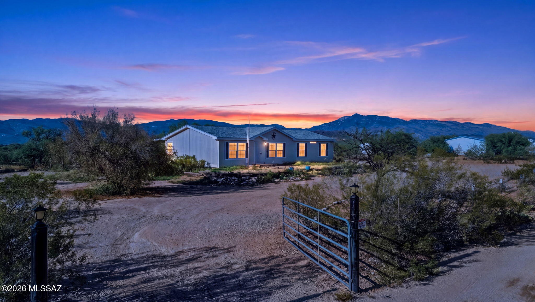 Range price $299,000-$310,000. Comfortable country living only 15 min from town. This 3 bedroom, 2 bath 1612 SF manufactured home was built in 2006 and sits on a flat useable acre. The back porch expands from end to end. Roof was replaced in 2022. The extraordinary functional floorplan features a central kitchen that splits the formal living room and master suite from the sunken family room and the two guest bedrooms. Enjoy sweeping views, and quiet living. Come. See. Stay!