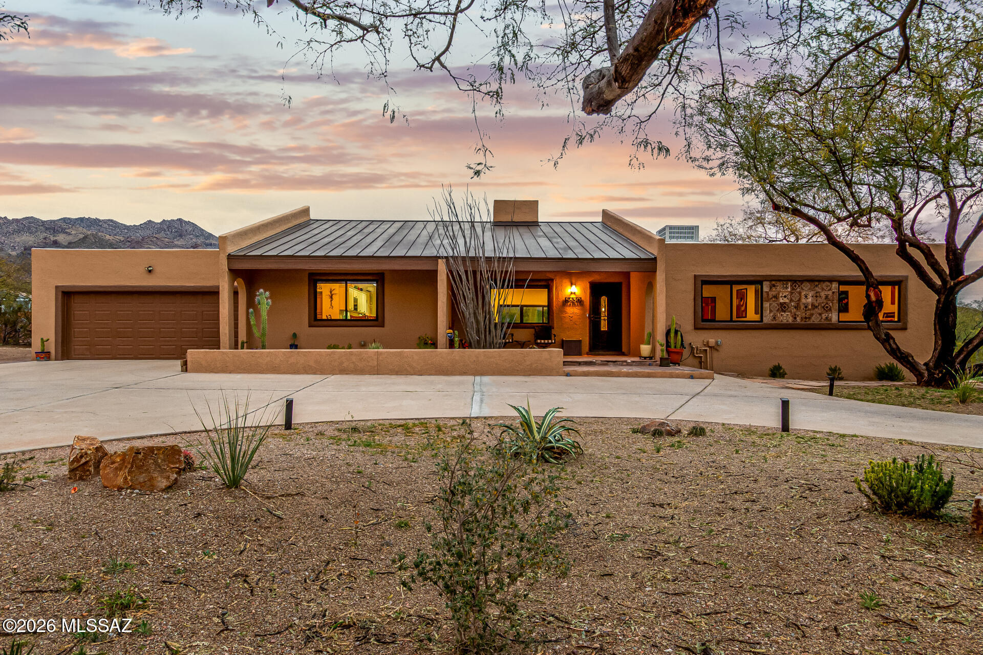 Your MOVE-IN ready District 16 home in the Catalina Foothills awaits!  This modern 3-bedroom, 2-bathroom home on one-acre has breathtaking mountain views, backyard oasis with a sparkling pool and spa, lighted circular driveway, 2-car garage, and meticulously designed low-maintenance desert landscape, The living room includes a vaulted beam ceiling that creates an airy & warm ambiance. New Pella windows flood the space with abundant natural light, highlighting the wood flooring throughout the entire home. New LED recessed lighting adds a touch of modern elegance, making this the perfect spot to relax or entertain friends & family.

The heart of the home is the fabulous kitchen designed to inspire culinary creativity, with all new counter-depth stainless steel appliances including Bosch induction stove/convection oven, Bosch dishwasher, microwave/air fryer/toaster oven combination, and Fisher & Paykel refrigerator. Enjoy sleek granite countertops, crisp white cabinetry with elegant crown molding, a stylish tile backsplash, a breakfast bar for casual dining, and a dining room.

The large primary bedroom boasts a gorgeous ensuite bathroom w/ a soaking tub & separate tiled shower, and backyard access to the pool. The remaining bedrooms are ample size and share the hallway full bathroom. The laundry room is located inside with additional storage. The washer and dryer, and all kitchen appliances, will convey.

Experience amazing Santa Catalina mountain views in your large and enclosed backyard oasis. The covered patio, stylish pavers, and a refreshing spa and pool create the ultimate setting for relaxation and entertainment. Whether you're hosting gatherings or unwinding after a long day, this space is designed for enjoyment. Just a few minutes away is the amazing Sabino Canyon as well as a shopping center with outstanding restaurants, grocery and other shops.  Make this gem yours today! An upgrades list is available upon request.