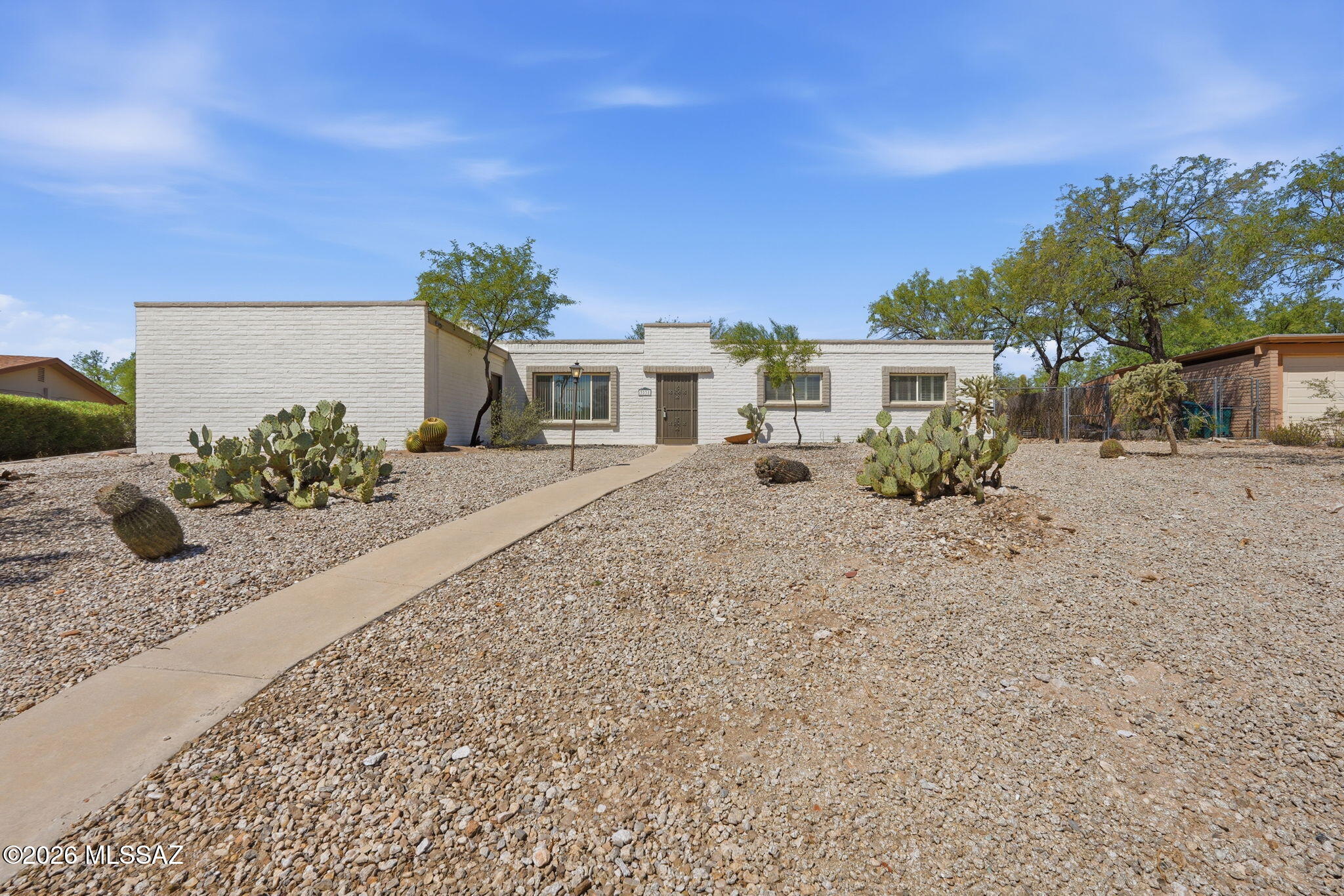 Beautiful updated home with with pool, hot tub, fireplace, granite counters, remodeled bathroom, new electric panel, external storage, RV gate, and beautiful views!