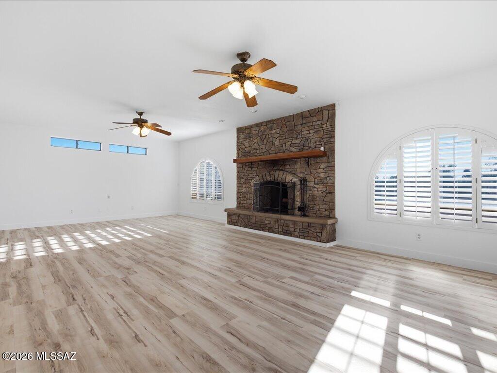 Owner/Agent - Renovated home on .62 of an acre, Pusch Ridge views. Private courtyard w/water feature. Vinyl plank floors, custom knotty alder cabinets. 4BR/3BA + den/office off primary suite w/dual walk-in closets; one BR has ensuite bath. Open family room, wood fireplace, plantation shutters. Covered porch to flagstone patio, outdoor kitchen w/grill, sink and eating bar. Two fire pits, hot tub, gardens, citrus on drip. Dog run, storage w/electric and water, 2-car garage. Detached 2 bedroom, 1 bath guest house  with walk-in closet for multi gen living or guests.