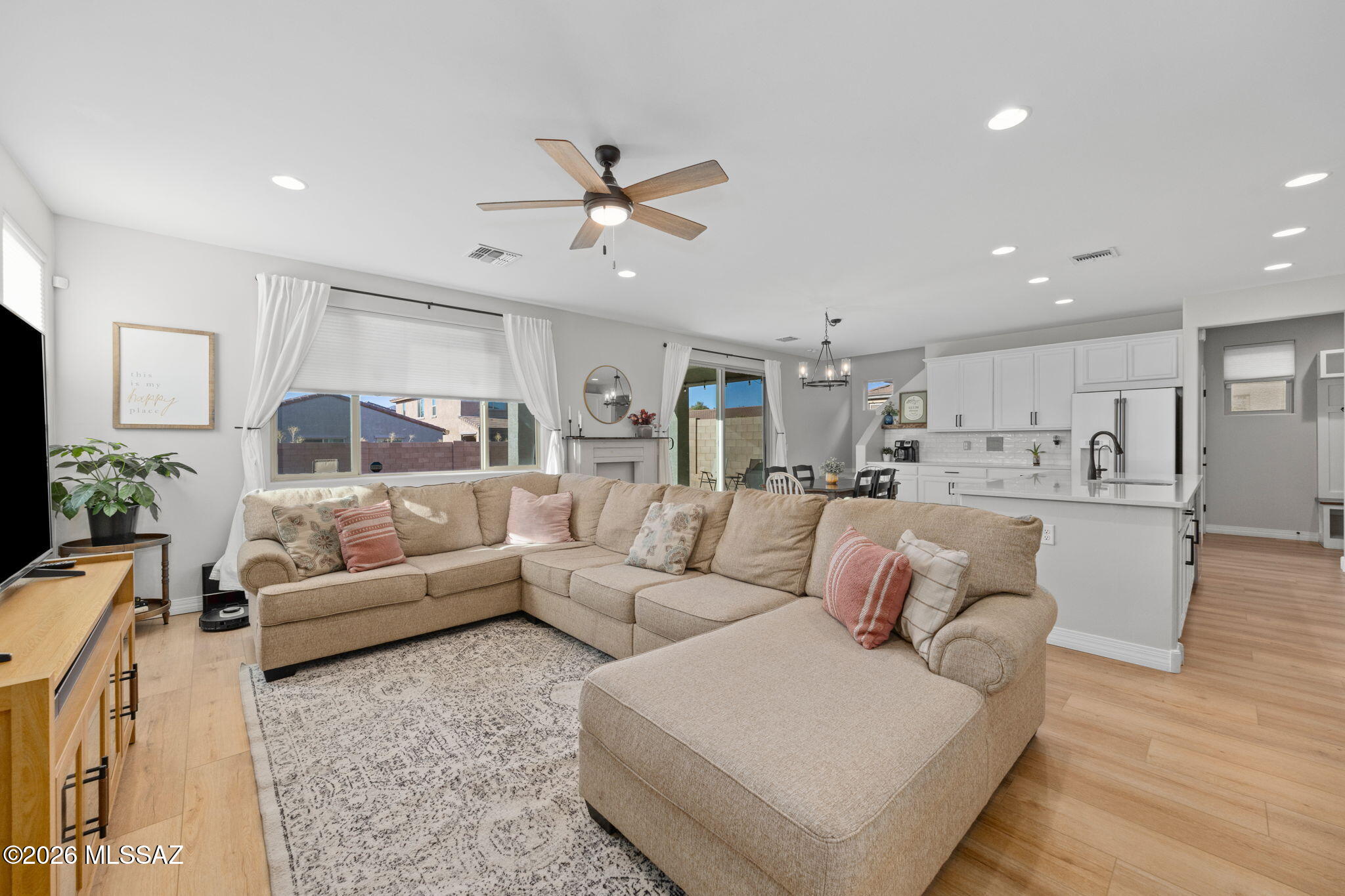 With four bedrooms, 2.5 baths, a dedicated office, spacious loft, and pocket office, this thoughtfully designed home offers room to live, work, and spread out. Fresh paint throughout and brand-new luxury vinyl plank flooring downstairs give the home a fresh feel, while the garage features epoxy floors and built-in storage. Speaking of storage, you'll have more places to tuck things away than you'll know what to do with, thanks to walk-in closets in nearly every bedroom, oversized linen closets, and laundry room cabinets. Permanent trim lighting and a landscaped backyard add appeal and convenience. Plus, this home offers two things new construction can't touch: a finished backyard and a highly desirable assumable VA loan with a lower-than-current-market interest rate for qualified buyers.