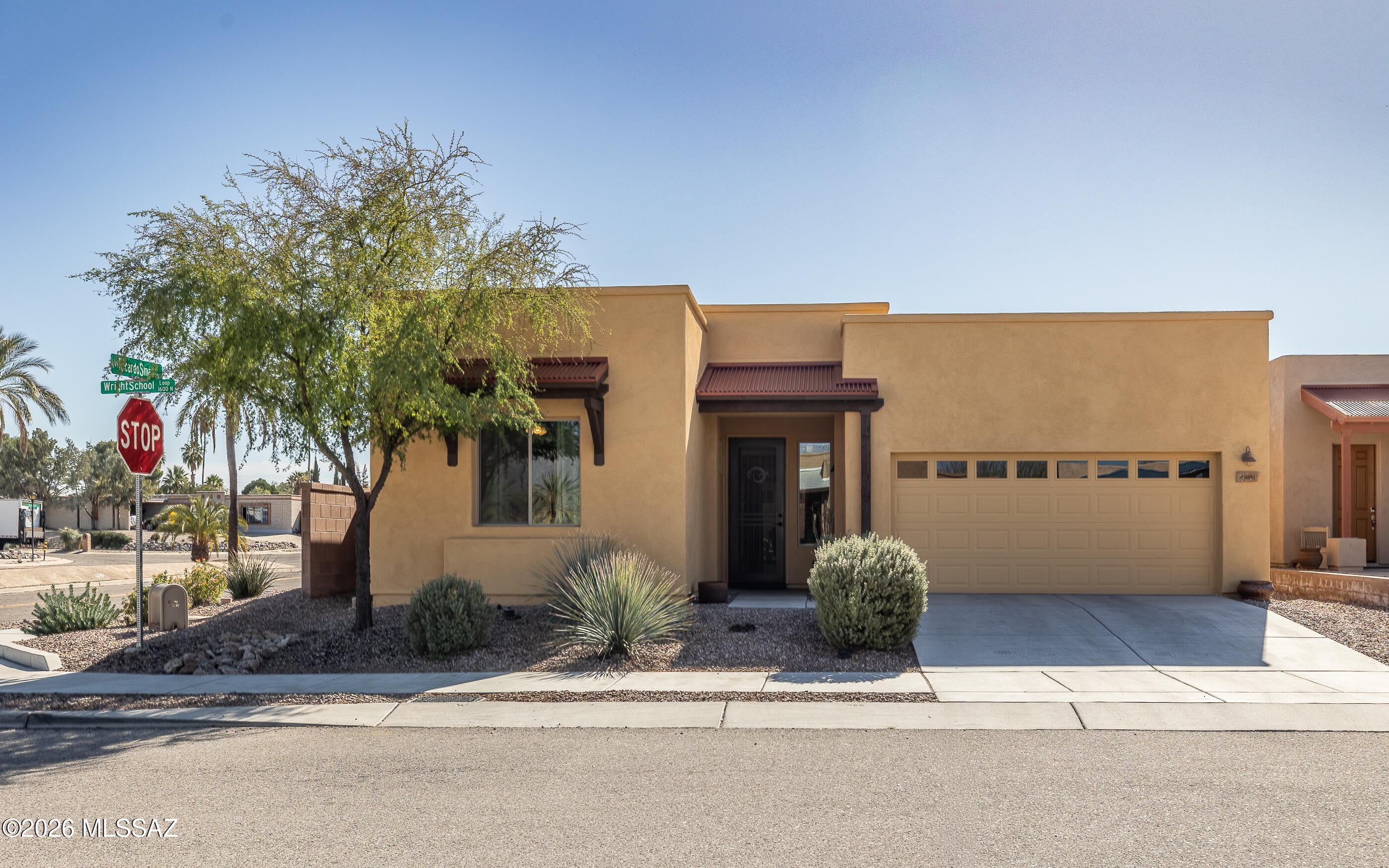 Priced to sell, this beautifully maintained Santa Fe-Style residence showcases true pride of ownership throughout. Built in 2017, the home offers three inviting bedrooms plus a versatile den, creating an elegant balance of comfort, style, and flexibility. Soaring 10-foot ceilings and impressive 8-foot doors enhance the home's open, airy feel, adding a sense of scale and sophistication throughout. Thoughtfully designed with warm Southwestern character and timeless architectural appeal, this home presents an exceptional opportunity for buyers seeking refined desert living. The residence extends it's charm outdoors with a backyard thoughtfully outfitted for gardening and a beautiful patch of grass that creates a welcoming retreat, An amazing opportunity awaits!
