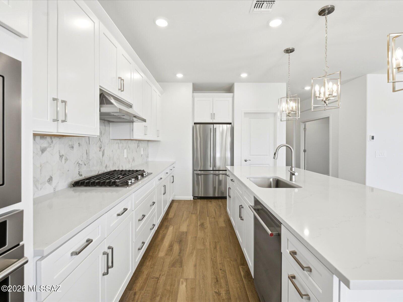 Oro Valley. Energy Efficient. Move in Ready. 

This thoughtfully designed 4-bedroom, 2.5-bath home features a tandem garage and a spacious great room--perfect for gathering with friends and family. Interior finishes include white cabinetry, soft gray quartz countertops, stone-look tile flooring, and warm neutral carpet.
Naranja Trails is now selling in Oro Valley, with homes starting in the low $600s. This gated community offers scenic walking trails and a prime location directly across from beautiful Naranja Park. Every home is built with innovative, energy-efficient features designed for lower utility costs, improved air quality, enhanced comfort, and lasting peace of mind.