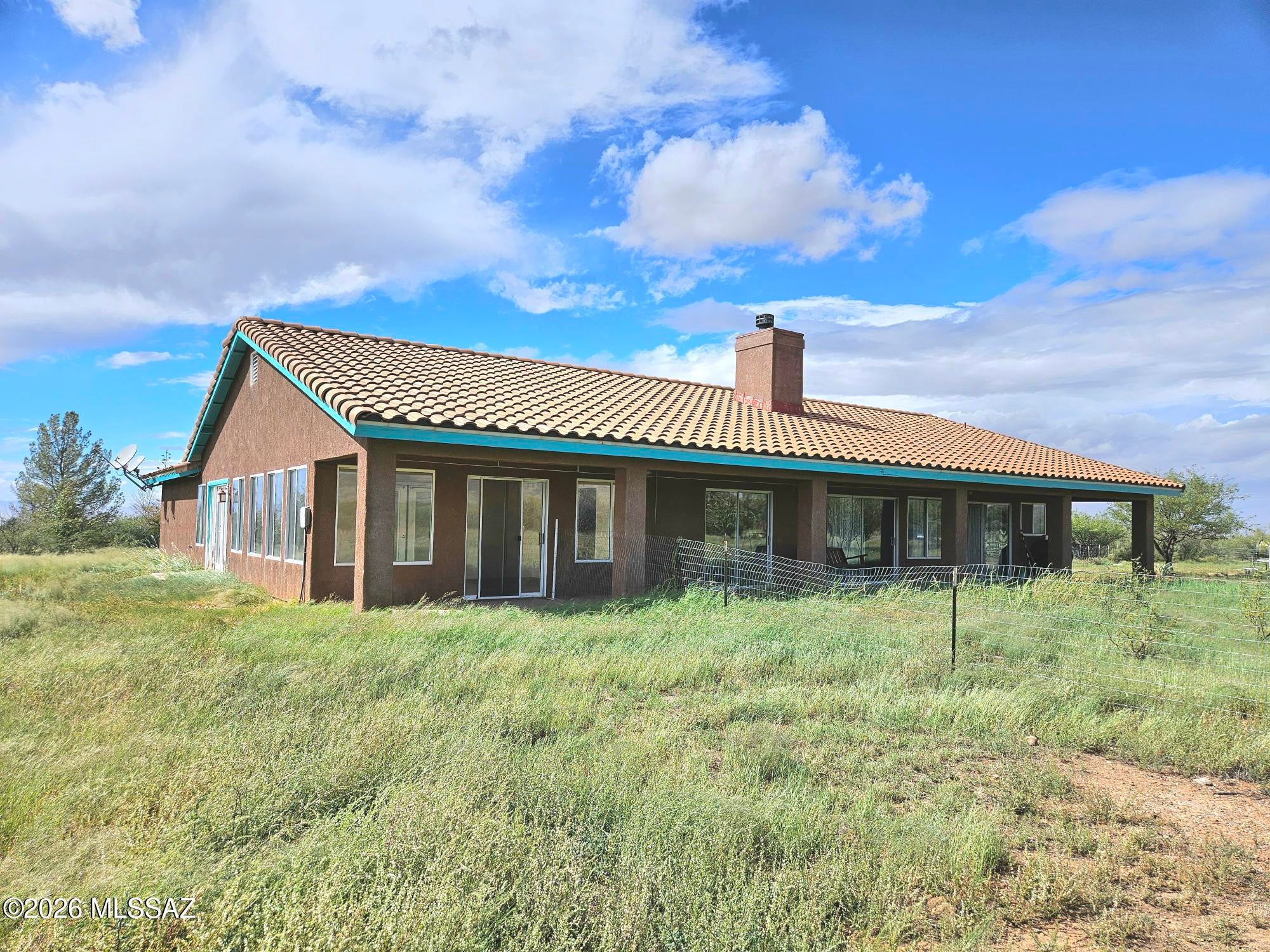If space & peaceful country living in a quality-built house is your dream, then this is the home you won't want to miss out on!  Beautiful, custom built  2,411 sq. Ft. Home on over 20 acres.  Fully fenced w/animal enclosures. Paddock for horses. Chicken coop.  Private registered well.  Home has concrete floors w/radiant heating, music studio & atrium.  Attached 2 car garage, large insulated building/workshop & an additional shed. Covered porch. Fabulous panoramic mountain views & great opportunity for star gazing. Turkey Creek & the Chiricahua National Monument are close by. Enjoy your privacy & the local wildlife. Close to paved Hwy 181 for easy commuting. This property is a must see!