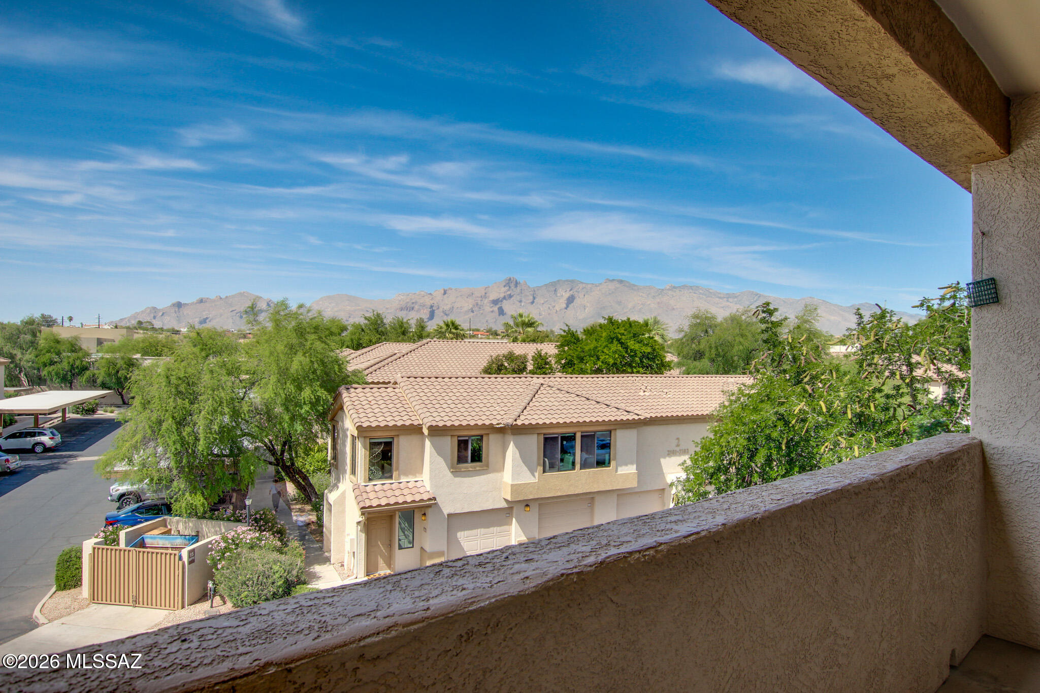 Motivated relocated seller! Seller is willing to cover up to six months of HOA dues with an acceptable offer.

Luxury, location, and serenity come together in this beautifully updated 2-bedroom, 2-bath condo in the desirable Villas at Hacienda Del Sol. Perched on the third floor, this home offers breathtaking, unobstructed views of the Tucson Mountains and spectacular sunset vistas.

Inside, you'll find an open-concept floor plan featuring wood-look laminate flooring, contemporary paint, and tasteful designer finishes throughout. The kitchen offers granite countertops, a stylish backsplash, and newer appliances, including a nearly new dishwasher and washer. The A/C system was replaced approximately four years ago, providing added comfort and peace of mind. Enjoy seamless indoor-outdoor living with a private balcony accessible from both the living room and the primary suite. The spacious primary bedroom features a walk-in closet and an ensuite bath with granite finishes. A split-bedroom layout provides privacy for guests or an ideal work-from-home setup.

Monthly HOA dues include water, gas, and trash service.

Residents enjoy resort-style amenities, including a heated pool and spa, fitness center, and direct access to the scenic Rillito River Park Trail.

Conveniently located near shopping, dining, golf, and Tucson's renowned foothills recreation, this gated community offers the perfect blend of comfort, convenience, and stunning desert beauty.

Gated community. Please contact the listing agent for gate access.