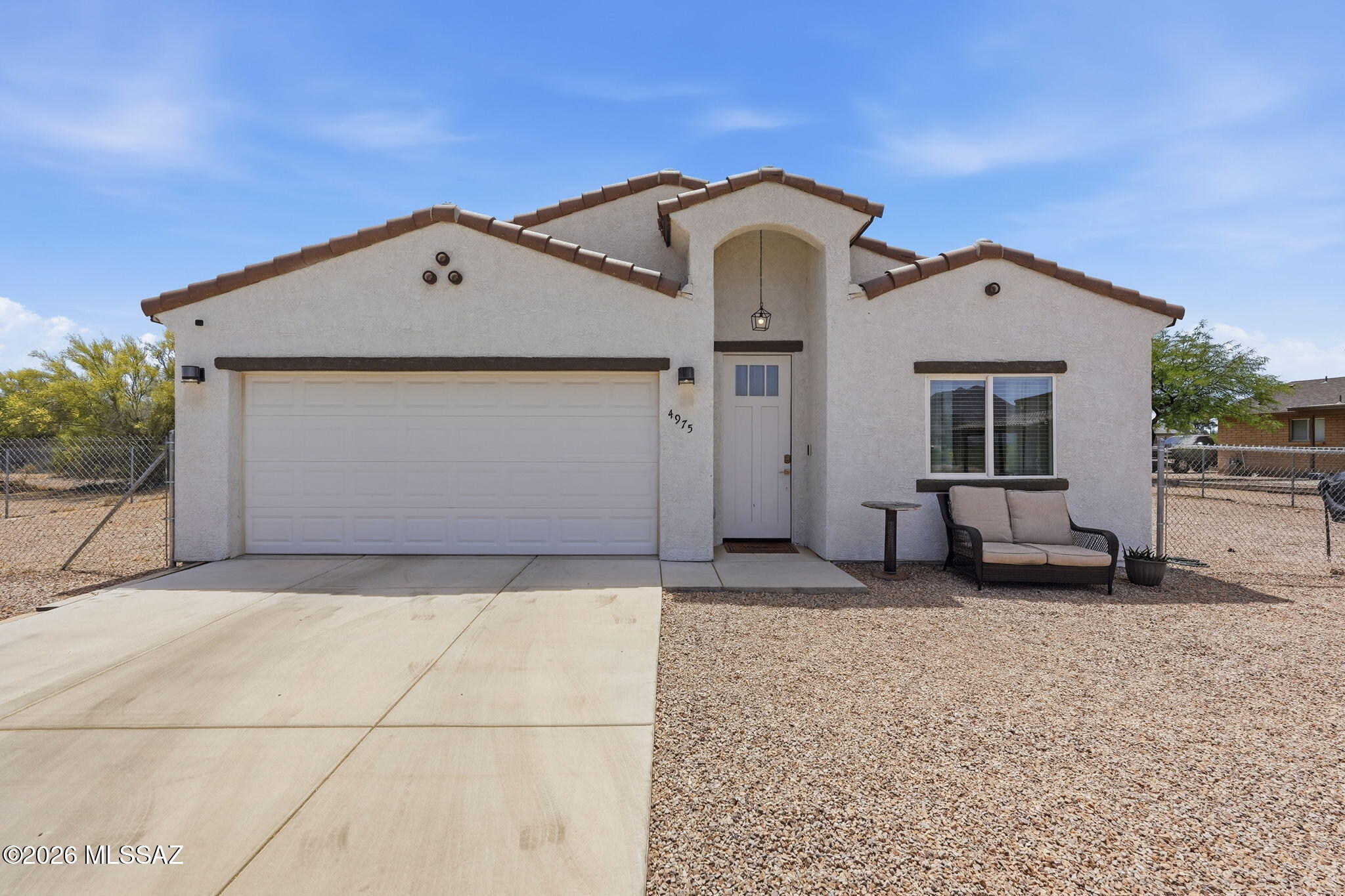 Newer Build • No HOA • RV/Boat Parking • Room for All Your Toys! Welcome to this 4-year-old home on Tucson's southwest side featuring modern finishes, ceramic tile flooring throughout, & a clean, move-in ready feel. The fully fenced backyard offers plenty of space for RV parking, trailers, boats, toys, or your own custom outdoor setup--with the freedom of no HOA! Enjoy peaceful desert living with quick access to hiking & biking trails in Tucson Mountain Park & Saguaro National Park. Ideally located near a brand-new multi-phase commercial development currently under construction, bringing future shopping, dining, & convenience nearby. Surrounded by mountain views and stunning Arizona sunsets, this home offers the perfect blend of flexibility, outdoor lifestyle, & long-term growth pote