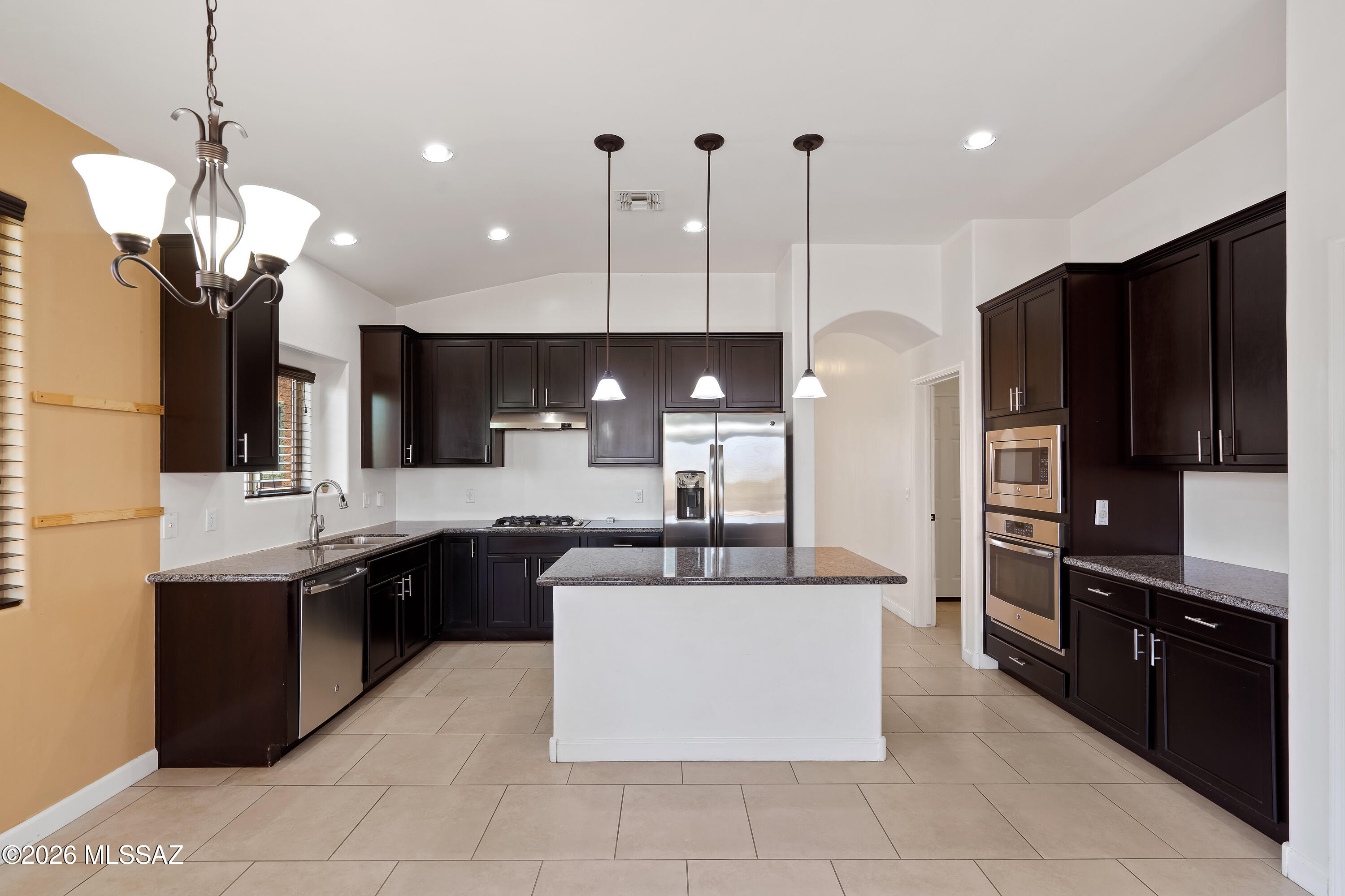 This well-appointed 4-bedroom, 2-bath home in desirable Northwest Tucson offers the perfect combination of comfort, functionality, and privacy. Featuring a spacious den that is ideal for a home office, playroom, or flex space, the thoughtfully designed floor plan is enhanced by soaring 9-foot ceilings that create an open and airy atmosphere throughout.

The beautifully landscaped backyard provides a private outdoor retreat, perfect for relaxing, entertaining, or enjoying Arizona's beautiful weather. With no rear neighbors, the property backs to scenic desert landscape, offering peaceful views and added privacy rarely found in such a convenient location. Ideally situated near Interstate 10, shopping, dining, and the Tucson Premium Outlets, this home offers easy access to everyday conveniences while maintaining a tranquil setting. Combining style, versatility, and a sought-after Northwest Tucson location, this home is ready to welcome its next owner.