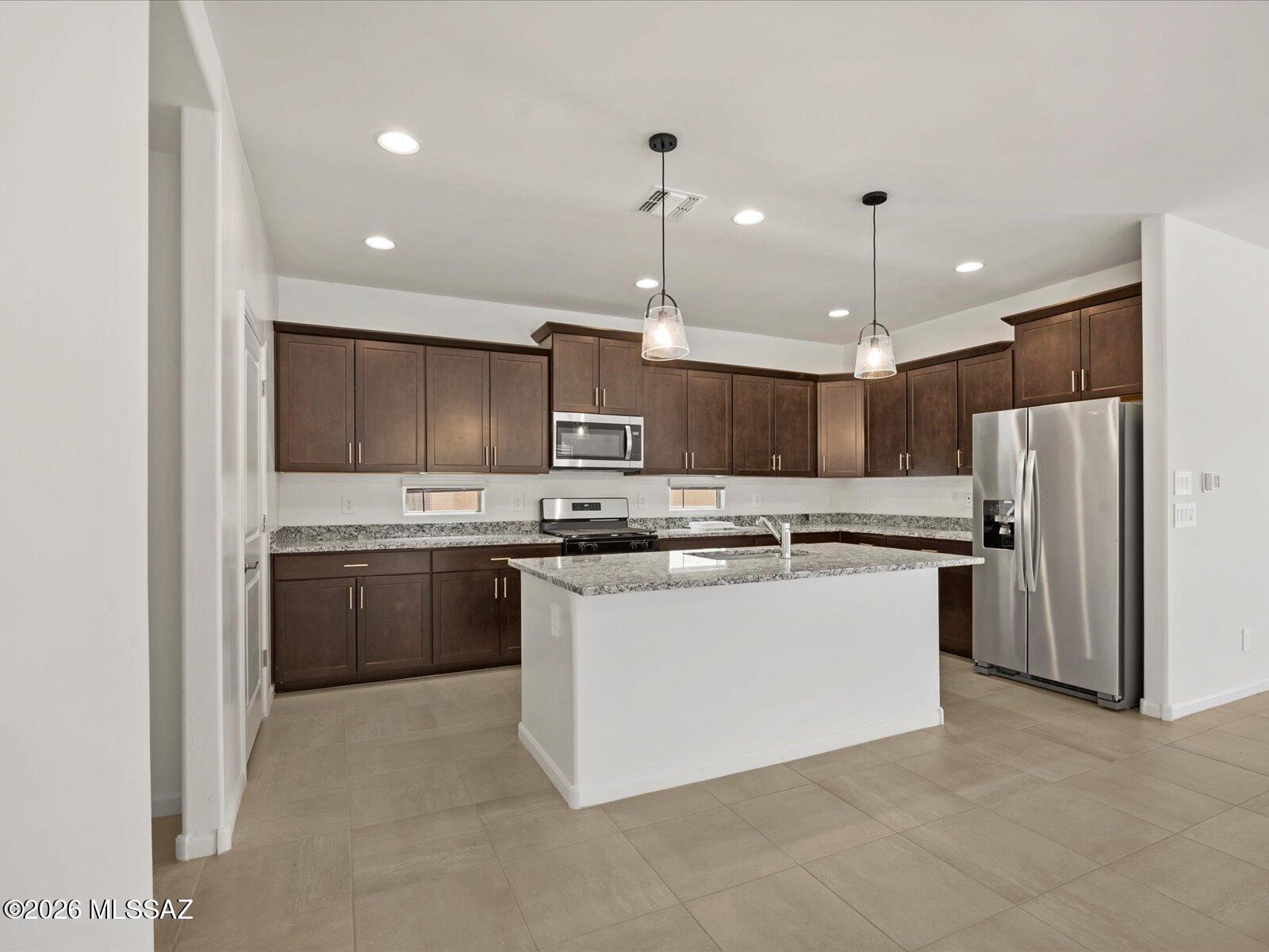 Brand new, energy-efficient home available by Sep 2026! Open layout that includes a spacious kitchen with island and a great room that leads to a covered patio. The fourth bedroom just off the great room can also be used as an office or playroom. Las Patrias at Star Valley Phase III - Signature Series is now selling in Tucson, AZ. Located less than 10 minutes from I-10, it offers convenient access to employment centers and downtown Tucson. This community features several amenities such as bike and walking trails and playgrounds. Move-in ready with a washer, dryer, fridge, and whole-home blinds; closing in 60 days or less - guaranteed. We'll reimburse up to $5,000 for delays we cause.  Each of our homes is built with innovative, energy-ef