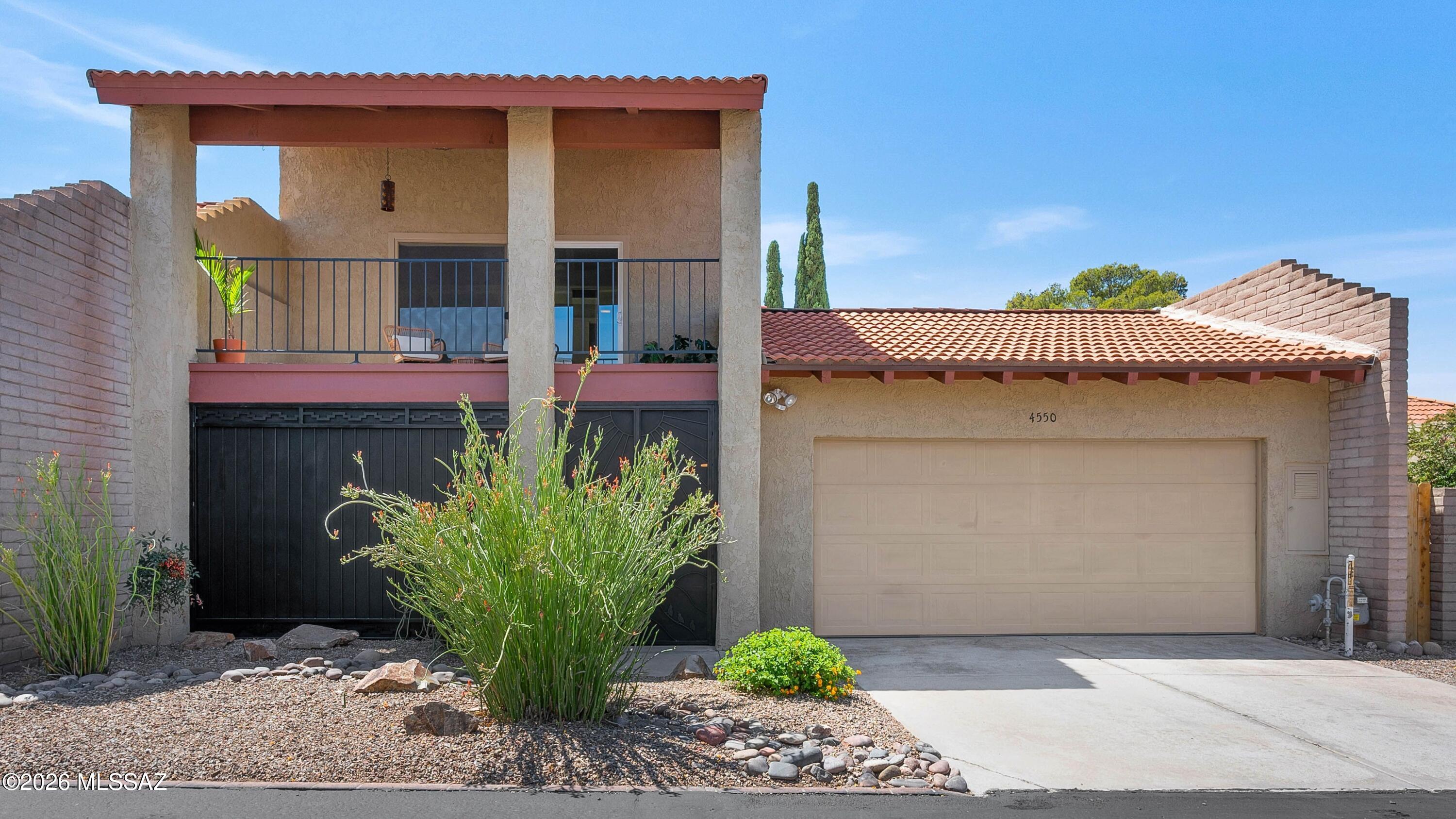 Beautifully updated home featuring an exceptional floor plan with two primary suites and a spacious third bedroom ideally situated in the Catalina Foothills. Move-in ready with fresh interior paint, updated kitchen and bathrooms, elegant travertine flooring throughout the main level. The expansive living area is filled with natural light and overlooks a private backyard shaded by mature trees. The upstairs primary retreat offers breathtaking mountain views from its private balcony. Residents enjoy an impressive array of HOA amenities including cable, internet, trash service, front landscaping, two pools (one heated), spa, clubhouse, fitness center, playground, and lighted tennis, pickleball, basketball courts. District 16 schools.
