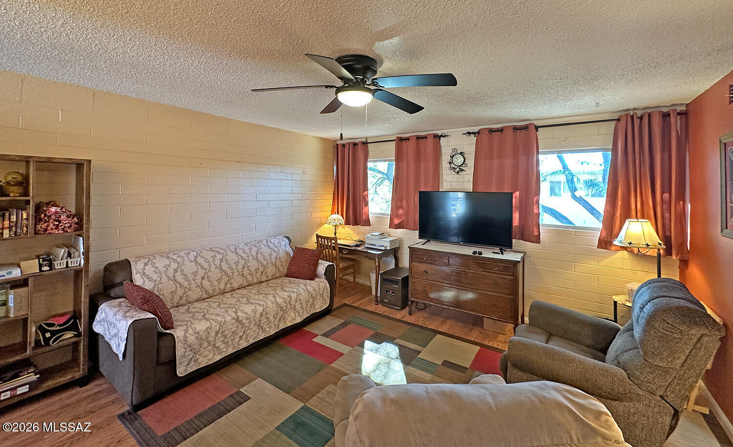 This charming upstairs 1‑bedroom, 1‑bath co‑op unit in Central Tucson features dual‑pane windows, co‑op-approved engineered wood flooring, a newer shower and vanity, and all appliances included. The enclosed patio has been incorporated into the bedroom, providing more space than the standard layout. The monthly co‑op fee covers property taxes, water, sewer, trash, roof, pest control, exterior maintenance, and more. Located just a few blocks from Reid Park—with its golf course, walking path, dog park, recreation center, and tennis courts—the home also offers convenient access to shopping, restaurants, bus lines, Downtown Tucson, and the University of Arizona. Cash only; no rentals allowed.