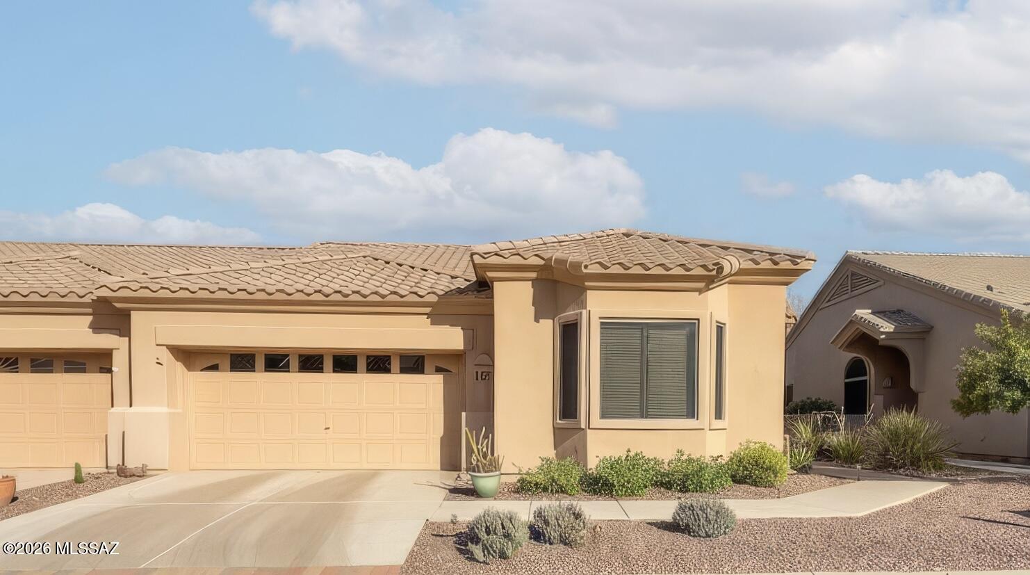 Turn-key and move-in ready, this beautifully maintained 1,593-square-foot home offers the perfect blend of comfort, style, and convenience in a desirable gated 55+ community. Featuring 2 bedrooms, 2 bathrooms, and a versatile den ideal for a home office, hobby room, or guest space, this fully furnished residence is ready for you to start enjoying from day one. Step inside to an open-concept floor plan with soaring vaulted ceilings, abundant natural light, and a desirable split-bedroom layout for added privacy. Elegant tile flooring flows throughout the home, complemented by custom paint, updated fixtures, bay windows, and rich maple cabinetry. The spacious kitchen features a stainless steel appliance package and opens seamlessly to the living and dining areas, creating an inviting space for entertaining and everyday living. Relax outdoors on the private, shaded back patio, complete with added sunshades, perfect for enjoying Arizona's beautiful weather year-round. The oversized 2-car garage offers exceptional functionality with built-in storage cabinets and a dedicated workstation. Additional upgrades include a newer HVAC system, a newer water heater, and attractive stamped epoxy-coated concrete surfaces. Residents enjoy access to a vibrant clubhouse with numerous amenities, all within the security and peace of a gated community. This exceptional home truly has it all--comfort, style, and a carefree lifestyle in a welcoming 55+ neighborhood.