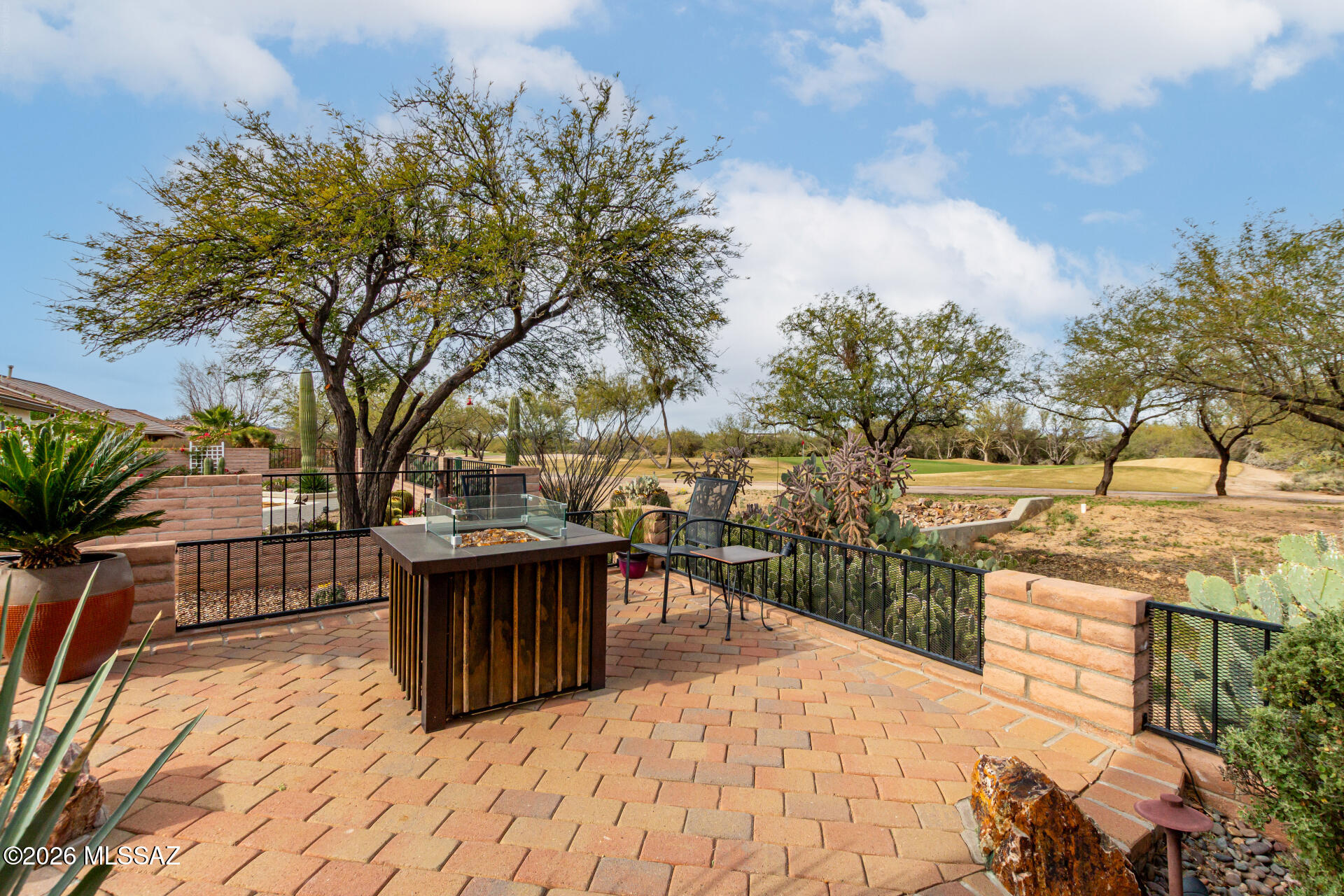 Golf course home perfectly positioned on hole 4 of the Coyote course at the end of the green. Beautifully upgraded and newly painted in the sought-after 55+ Quail Creek community of Green Valley. The home features quartz countertops in the kitchen and baths, creating a polished, move-in-ready feel. Enjoy built-ins in the den with electric fireplace and tiled flooring throughout the main area. The detached casita with dreamy courtyard is fully air-conditioned and plumbed for future bath offering endless possibilities as a guest suite, studio, or private office. Enjoy peaceful mornings and effortless indoor-outdoor living in a setting that truly feels like a retreat. 2 car garage with side paved path that comes into a dedicated golf cart space. Resort style living with world class amenities.