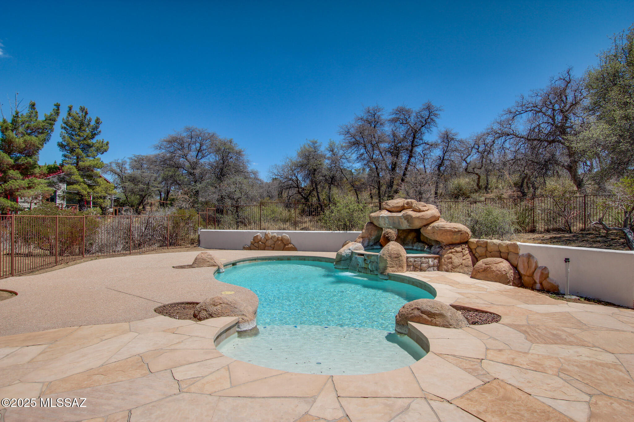 New available!  Single family home in the charming rural community of Oracle, Arizona!  This stunning home sits on a generous .62-acre lot and boasts a warm and inviting kitchen with rich brown cabinets, durable countertops, and stainless steel appliances. The property has been recently updated with fresh interior and exterior paint, luxury plank flooring, and modern electrical and plumbing fixtures.  You'll truly appreciate the gorgeous scenic landscape, as the home is nestled in the foothills of the Santa Catalina Mountains.  Backyard complete with resort-like oasis that features a sparkling pool, a relaxing spa, a beautiful water feature, and a built-in BBQ area perfect for entertaining. It's a must-see!