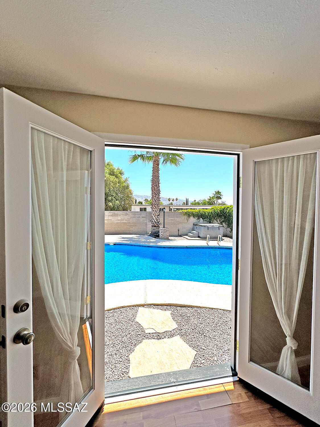 Welcome to this beautifully updated 3-bedroom, 2-bath home in desirable East Tucson--perfectly move-in ready and packed with upgrades! Enjoy ceramic tile flooring throughout, a newly coated roof, and brand-new dual-pane windows that bring in natural light while boosting energy efficiency.
The kitchen features a new dishwasher and a convenient under-sink reverse osmosis system. The primary bedroom has been enhanced with new French doors and an added window, creating a bright and inviting retreat.
Step outside to your private backyard oasis! The yard is tastefully paved and includes a comfortable ramada--ideal for relaxing or entertaining. The sparkling pool has just been drained, recoated, and updated with a new light--perfect for cooling off while enjoying scenic mountain views. More... You can also enjoy the hot tub during the cooler nights! Additional highlights include a fully remodeled laundry room with new drywall, a sliding glass door, and added utility sink, plus a 1-car garage for convenience.
This home truly has it all--style, comfort, and thoughtful upgrades throughout. Don't miss your chance to make it yours!