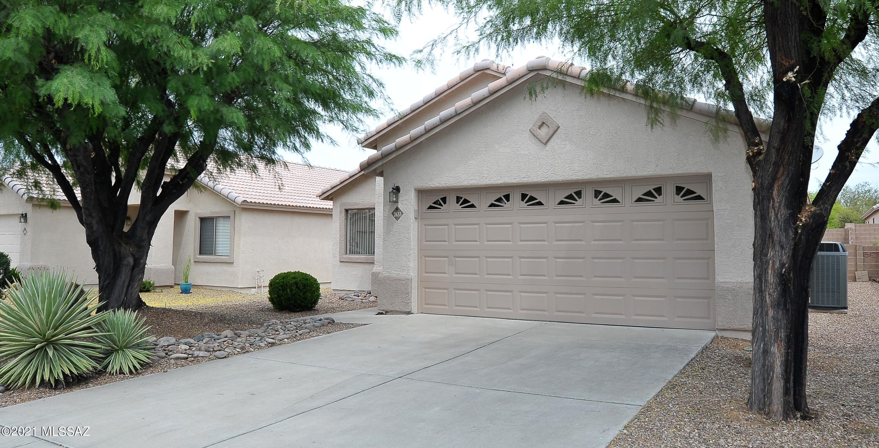 Don't miss this fresh and ready home in gated NW neighborhood with beautiful ceramic tile flooring throughout - no carpet! Granite in kitchen with stainless steel appliances. Granite in both bathrooms. Washer/dryer included. Ceiling fans in living room, family room and all bedrooms. Newer AC and water heater. North/south orientation with north facing backyard. 2 car garage and tile roof. Trash service included. Sought-after subdivision in a great location close to YMCA, Pima NW campus, parks, schools, easy  I-10 access and much more!  Non-smoking home.  One year minimum lease - no short term leases. Call listing agent for pet policy and additional leasing requirements. Owners are licensed Real Estate agents in AZ.