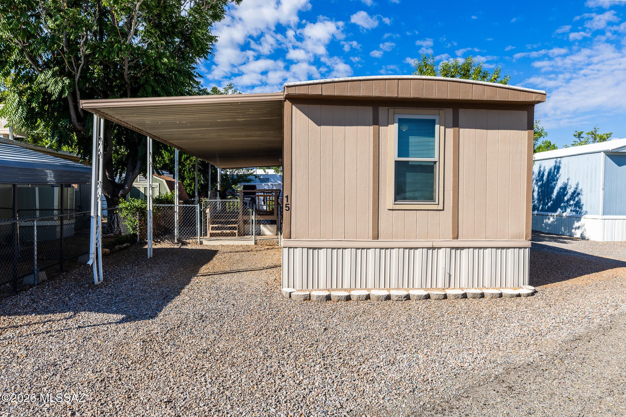 Welcome to this charming 2 bedroom 1 1/2 bath manufactured home in an inviting 55+ community. This well maintained home offers numerous recent updates and is ready for its next owner. Inside you will find new laminate flooring, updated energy efficient windows, fresh interior and exterior paint, new refrigerator, stove and dishwasher, LED lighting, ceiling fans and updated outlets and switches. Additional improvements include updated valves, an overhauled A/C system in 2025, home was recently leveled and recently recoated roof. Home is located on leased land with a lot rent of $400 a month. Taxes are for home only. Buyers must apply and obtain park approval. Some furniture stays.