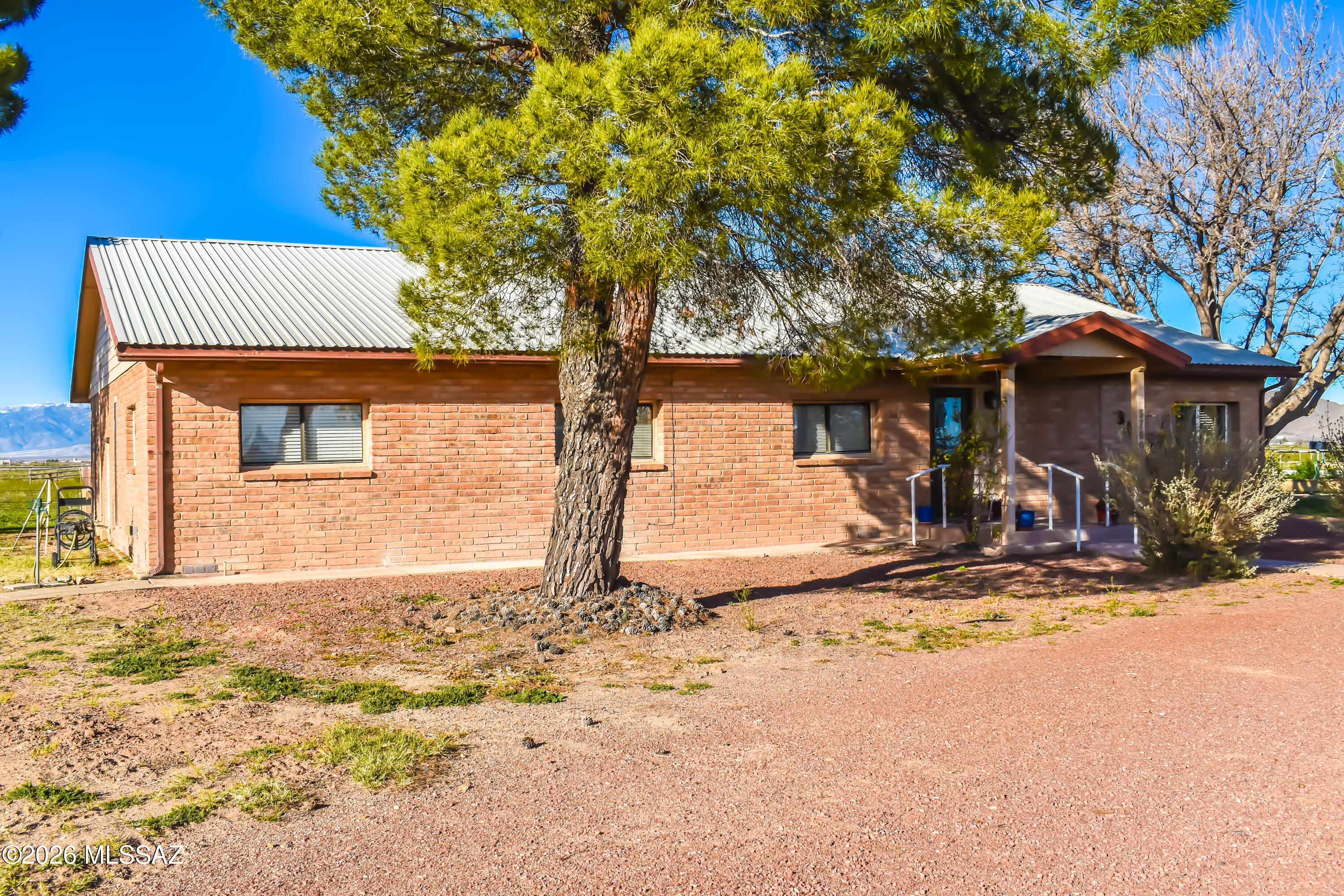 Experience wide-open country living on this exceptional 15-acre horse property featuring a spacious 4-bed, 2-bath, approximately 2,467 sq ft brick home built in 1983. Recently remodeled throughout, this residence offers comfortable living with a durable metal roof, generous room sizes, and classic ranch-style charm. An additional 18' x 48' manufactured home sits on the property, offering flexible use as guest quarters. A standout feature of the property is the 2,594 sq ft shop, complete with Two full-size car areas. Ample room for equipment, vehicles, hobbies, or a home business Endless potential for mechanics, craftsmen, or storage needs. This once Horse facility/ stable has turned into a garage shop with plenty of room. Beautiful Views surround the property. A must see.