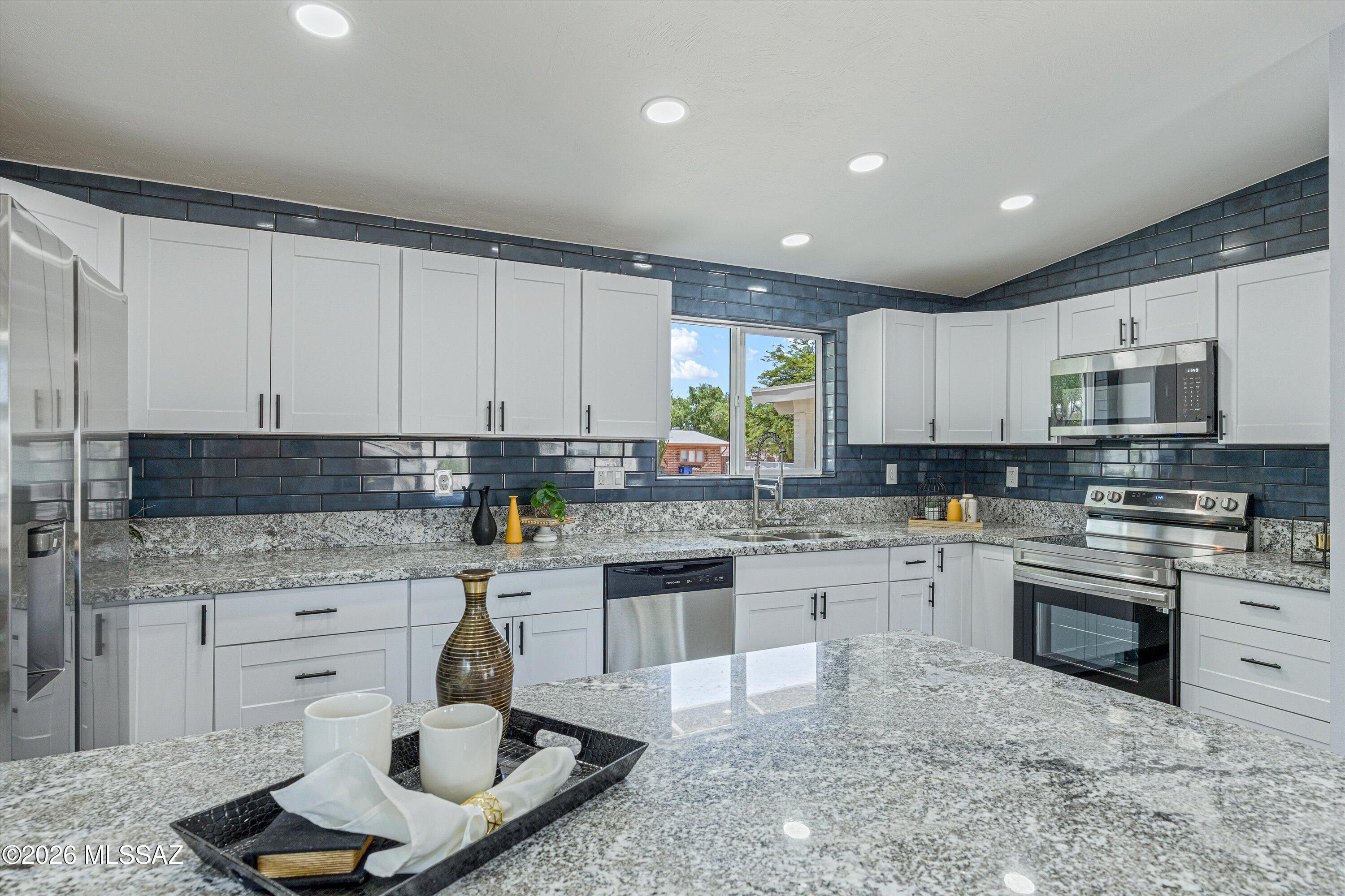 This beautifully renovated home in highly sought-after Rolling Hills area with PAID Solar, features a bright and open floor plan, comprising four bedrooms and two bathrooms. The expansive great room features a stunning artistic fireplace as it's focal point and seamlessly connects to a large kitchen equipped with new stainless steel appliances. Freshly painted both inside and out. The property boasts attractive landscaping with low-maintenance yards, making it an ideal choice for potential buyers. This home is truly a must-see.